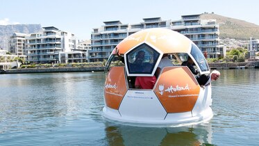a boat shaped like a soccer ball