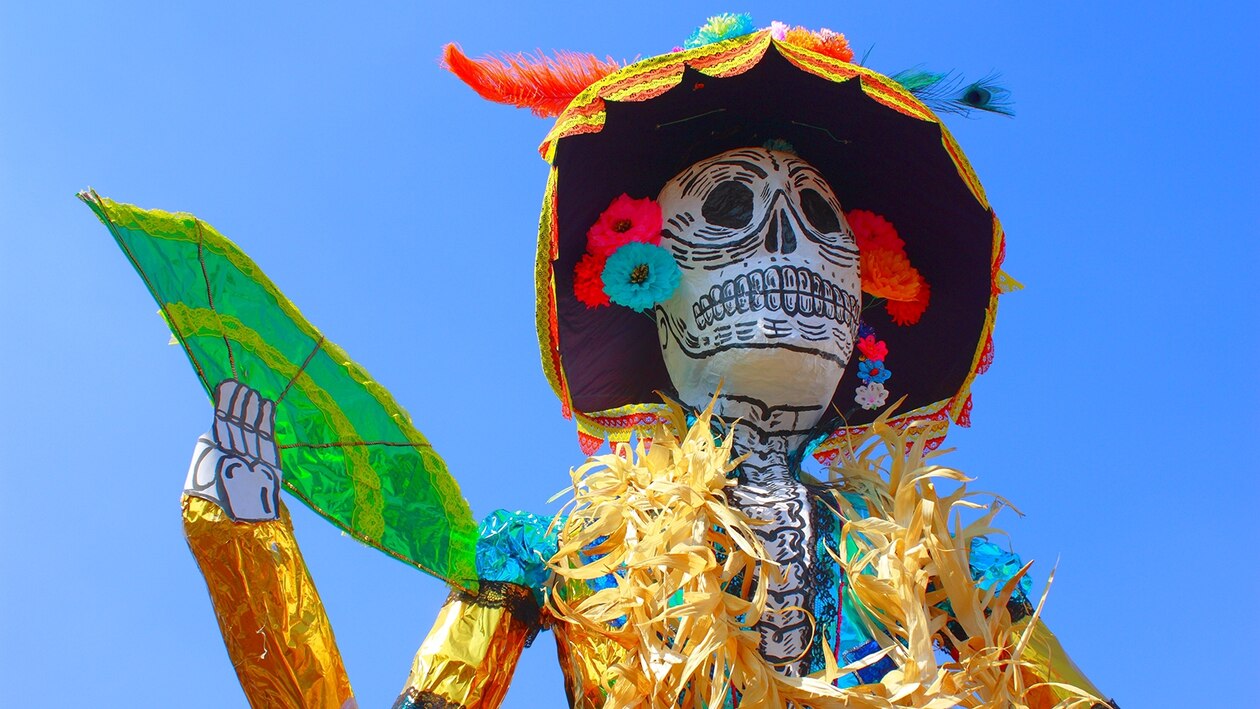 a colorful fake skeleton posed for Day of the Dead.