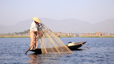a man in a fishing boat