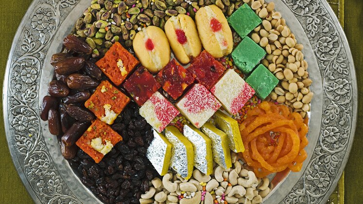 Families celebrate Diwali with sweet treats.