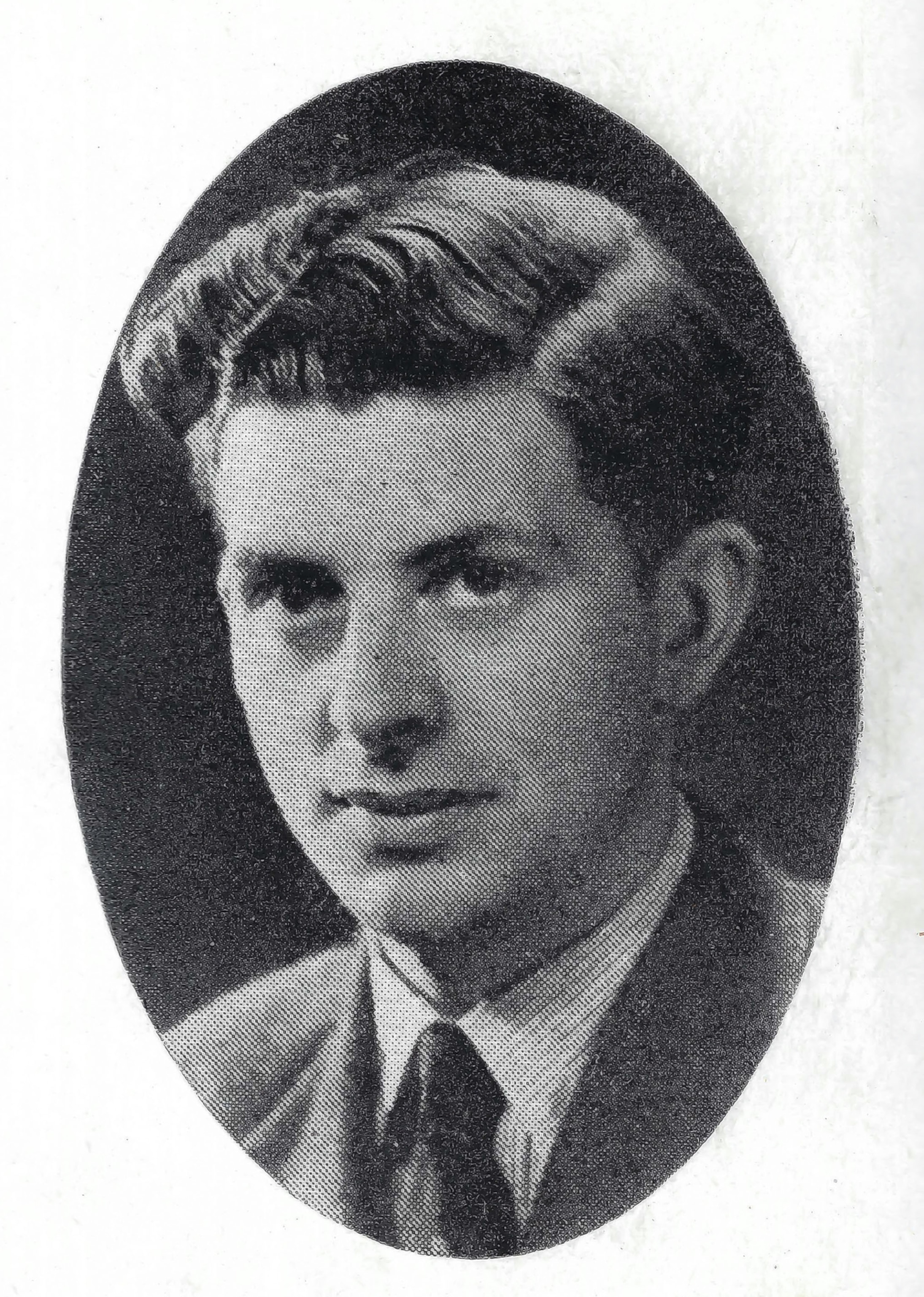 A black and white portrait of a young man.