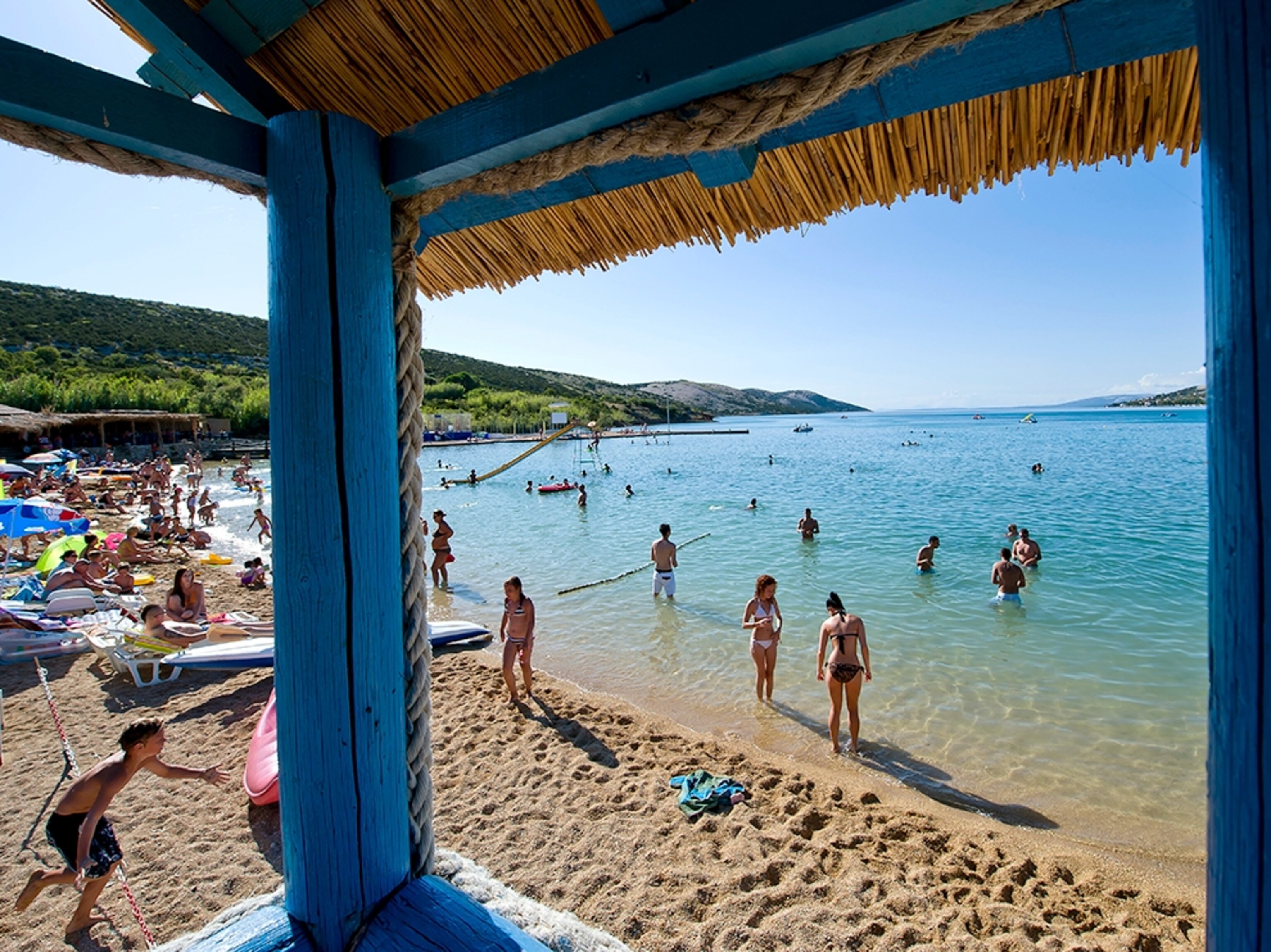 sunbathers on Novalja Beach, Croatia