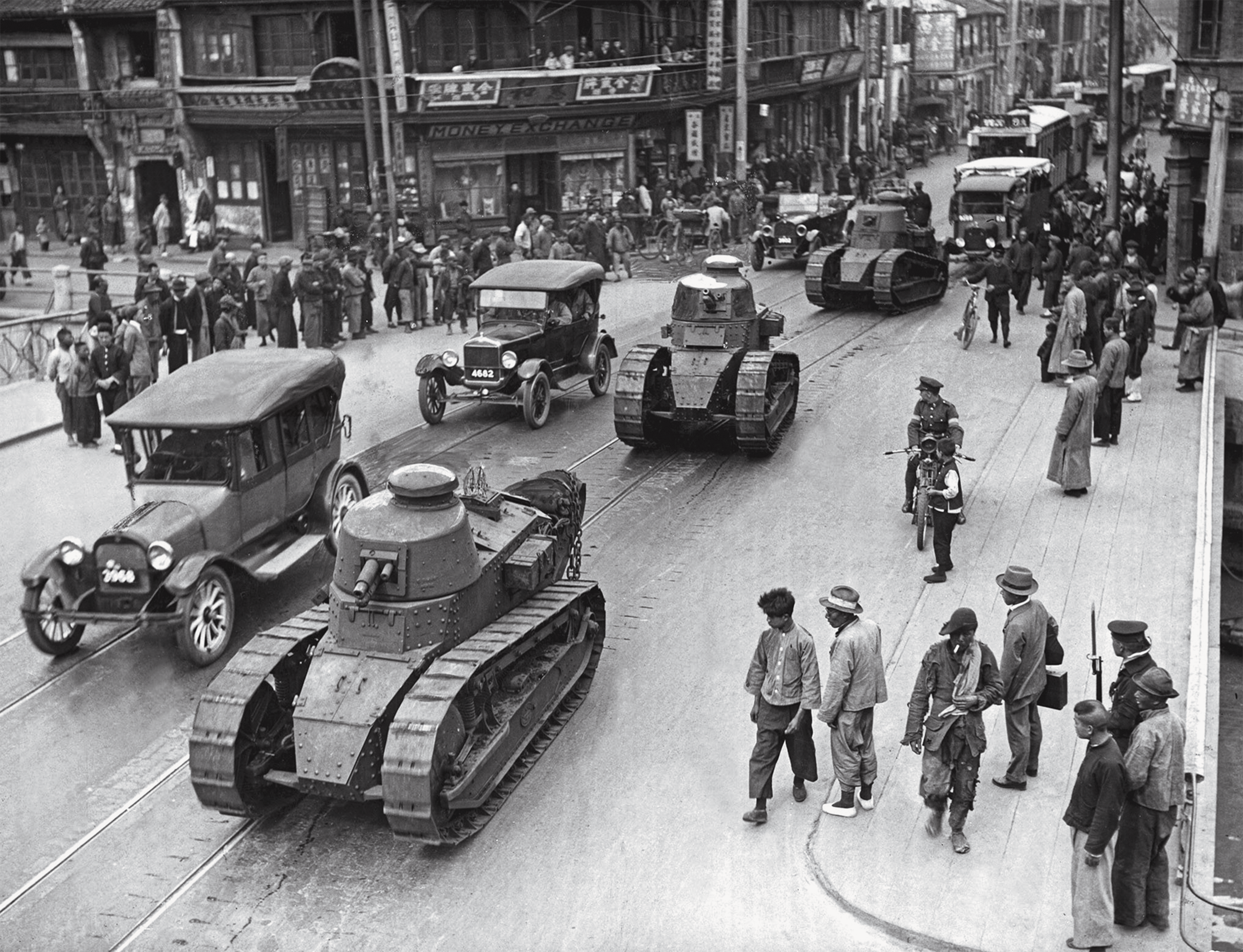 French tanks patrol the streets of Shanghai.