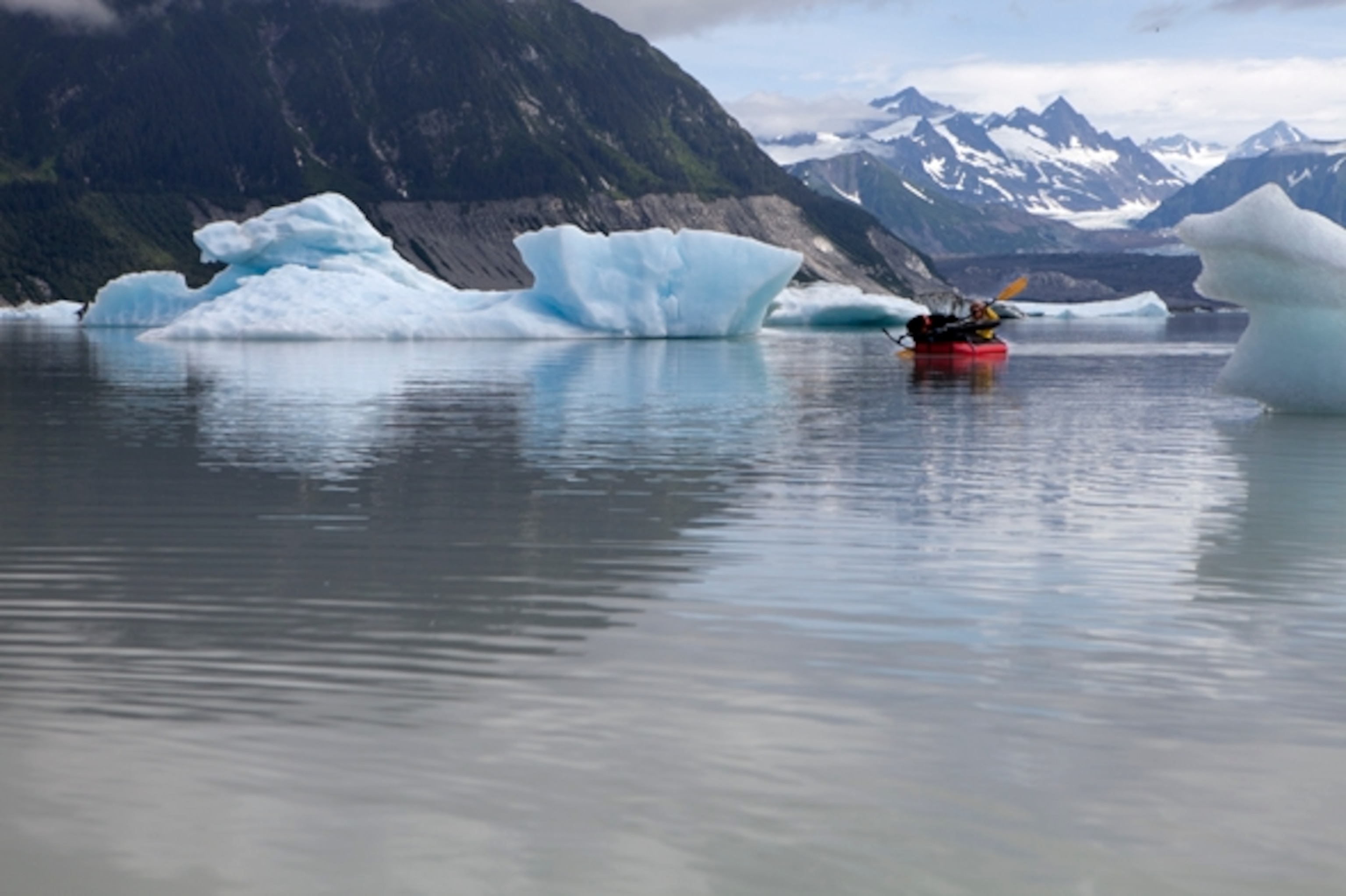 The compressed glacial ice glows blue to the eye. All the colors of the visible light spectrum are absorbed, but the color blue is reflected; Photograph by Cameron Lawson
