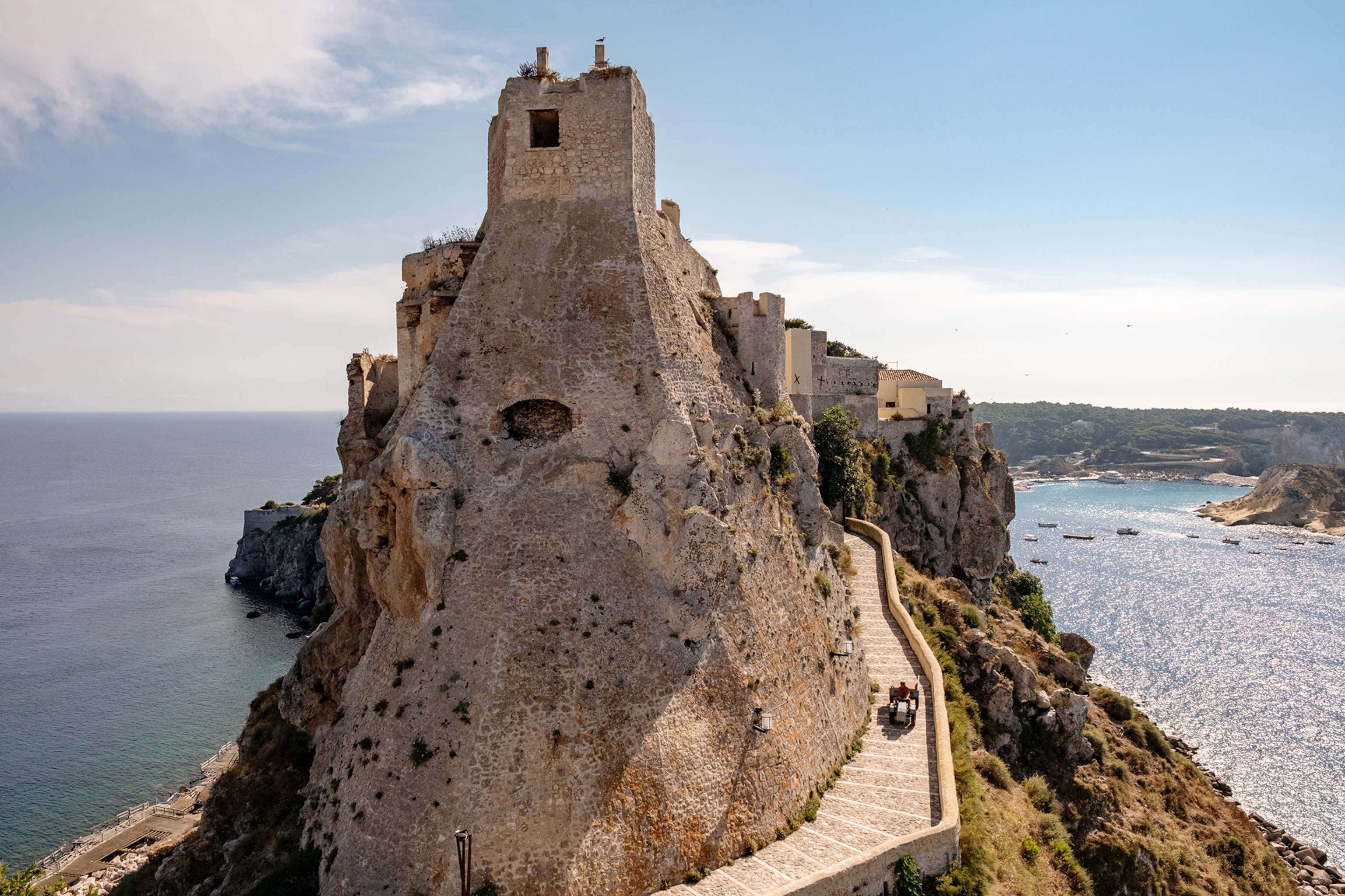 An Italian island with a rugged coast line and a Roman villa built into an imposing rock.
