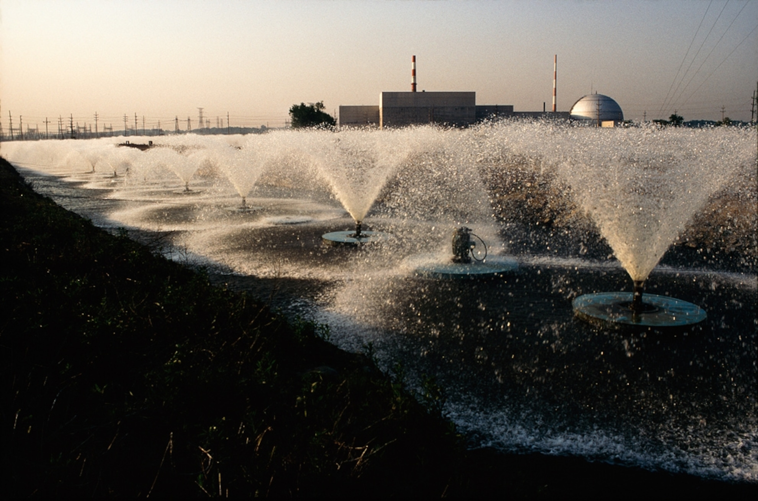 Fountains cool waters at the Dresden nuclear power plant.