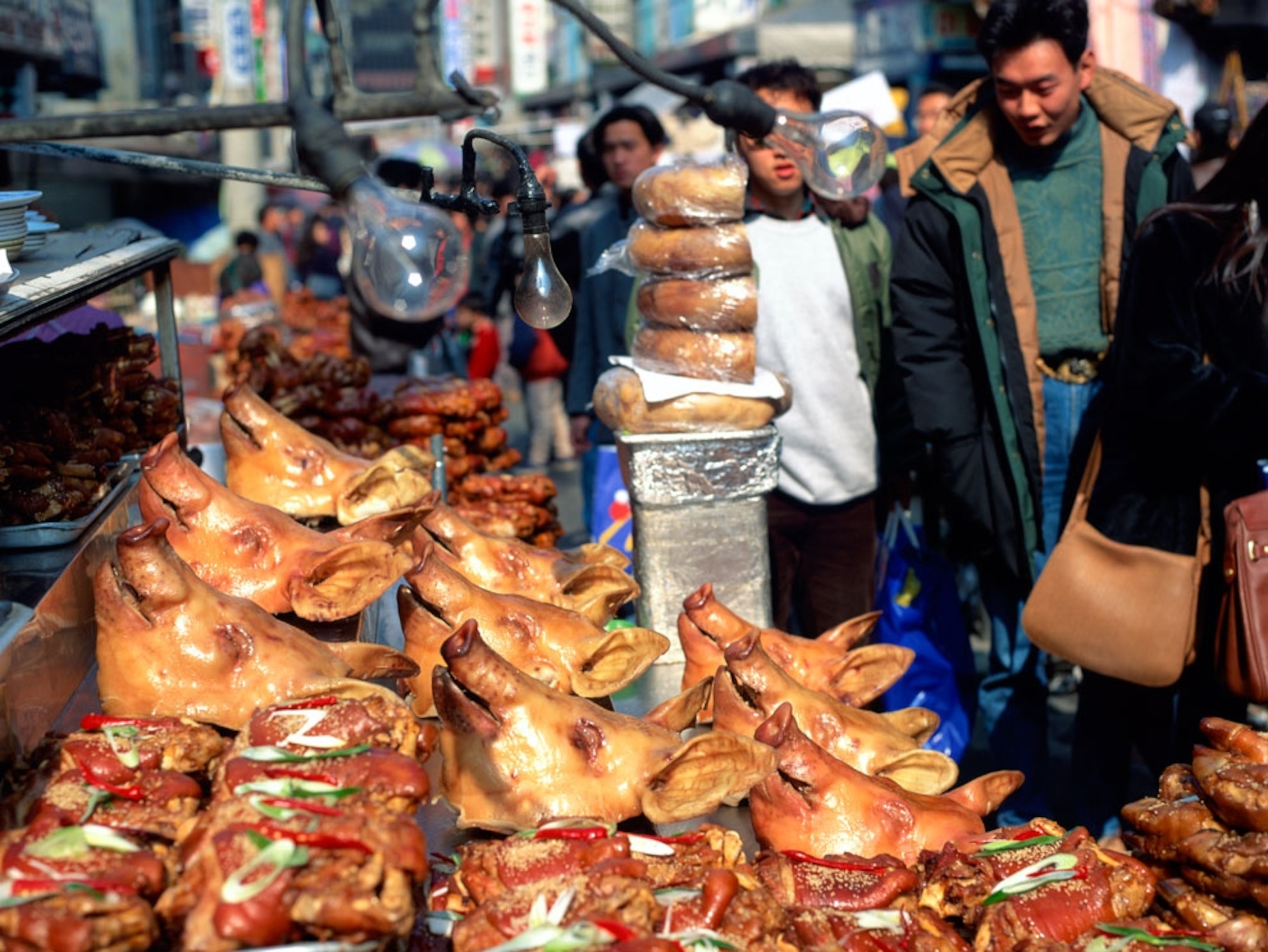Pig heads and other pork products in a market stall