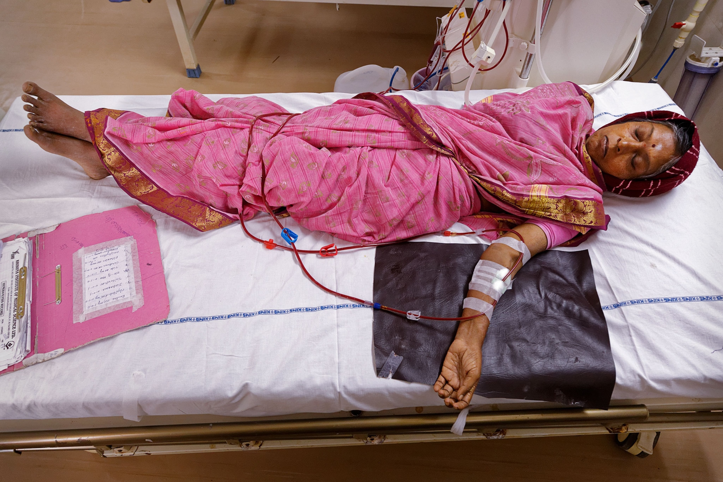 a woman lying in a hospital bed