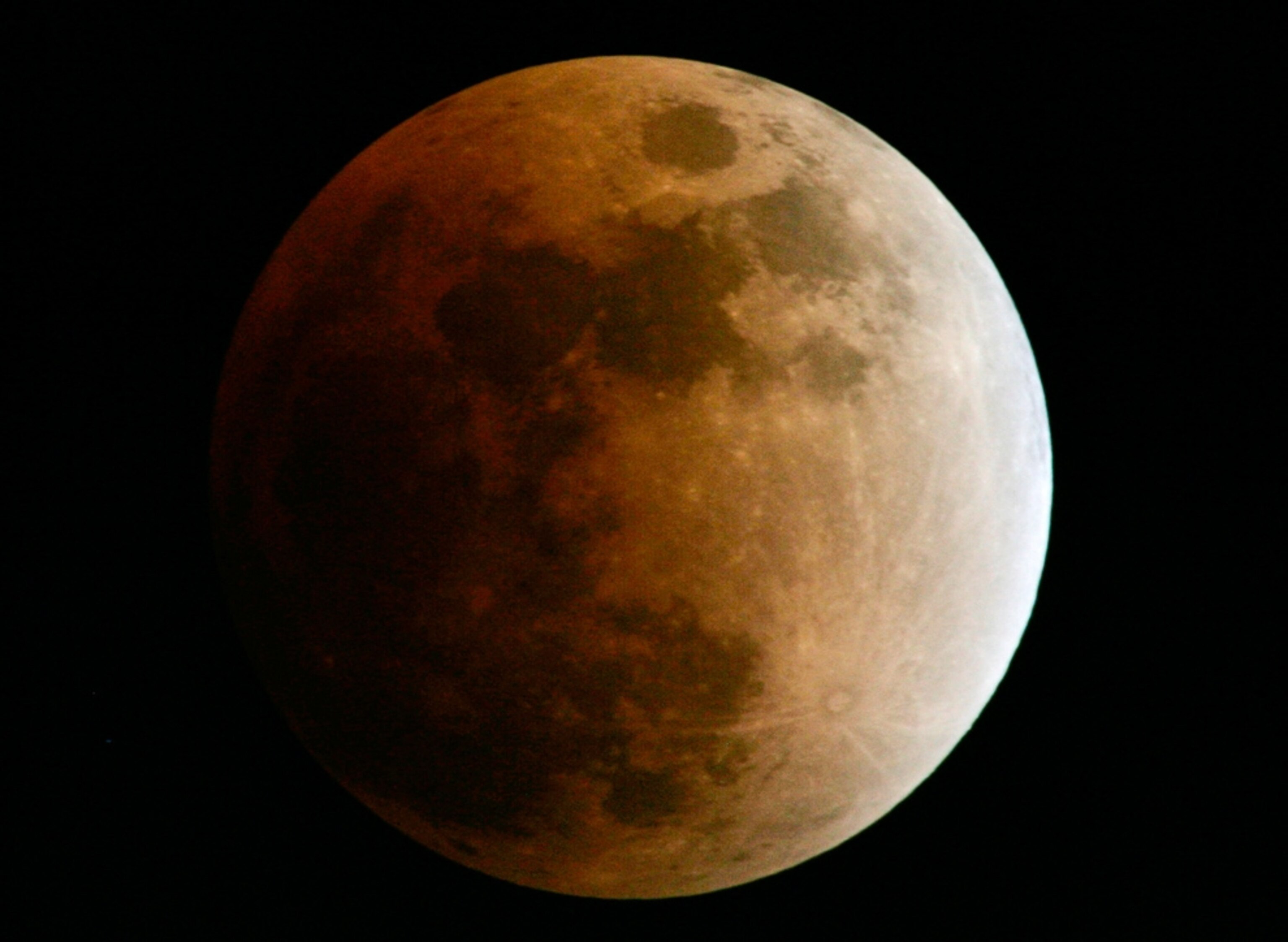 A lunar eclipse picture shows a total lunar eclipse over Wisconsin.