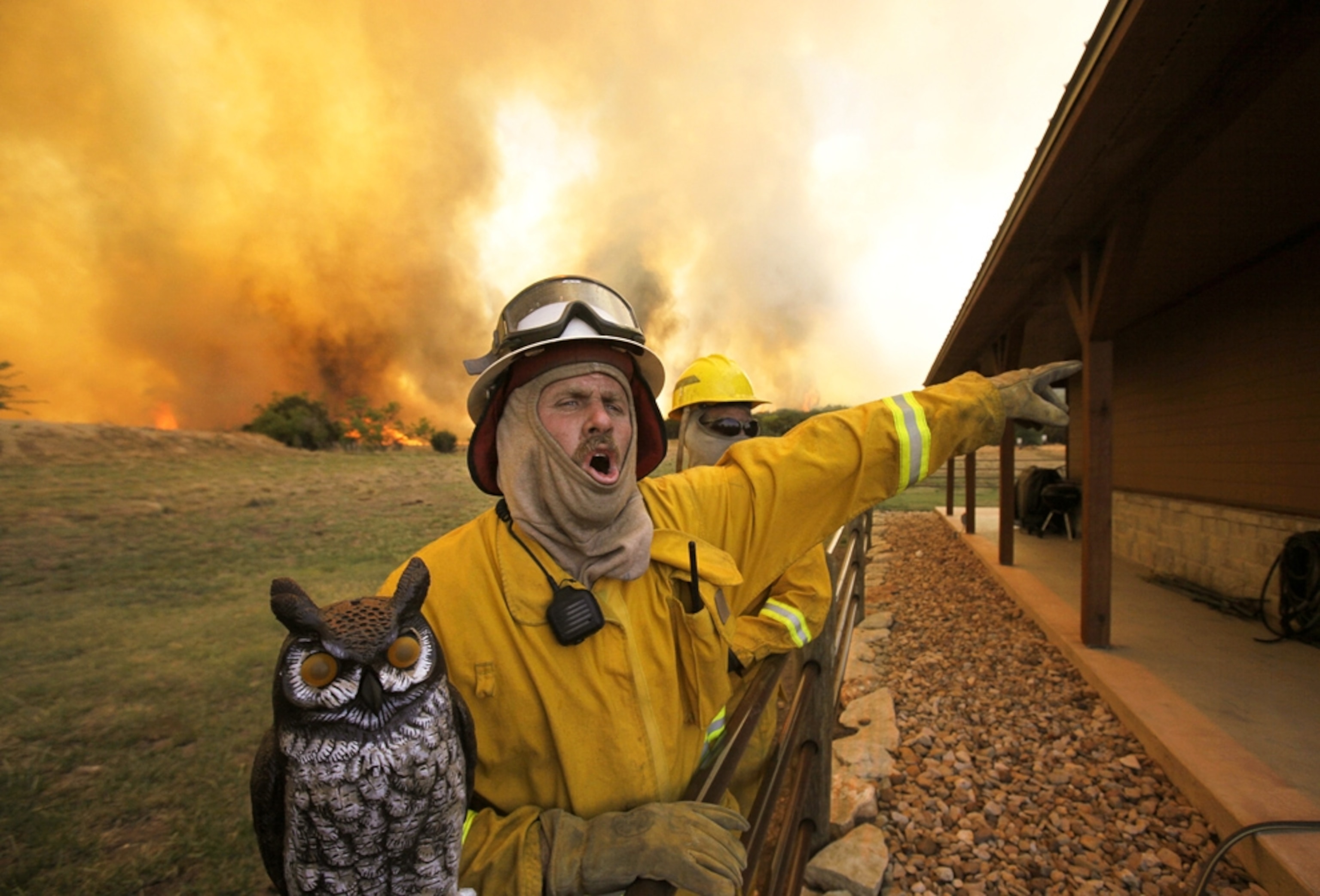 Texas wildfire picture: Firefighter at a home in Texas