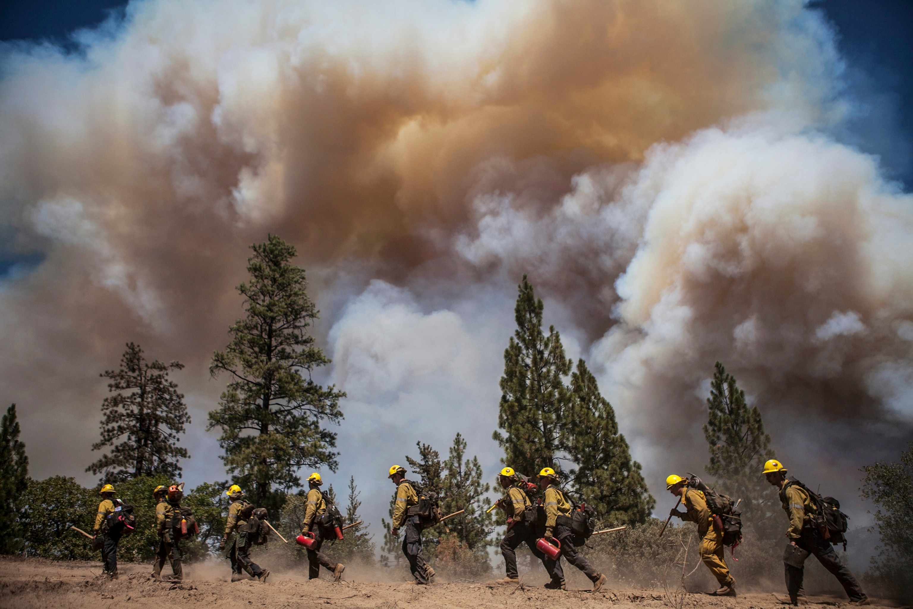 Los Angeles County firefighters hiking a fire line on the Rim Fire near Groveland, California