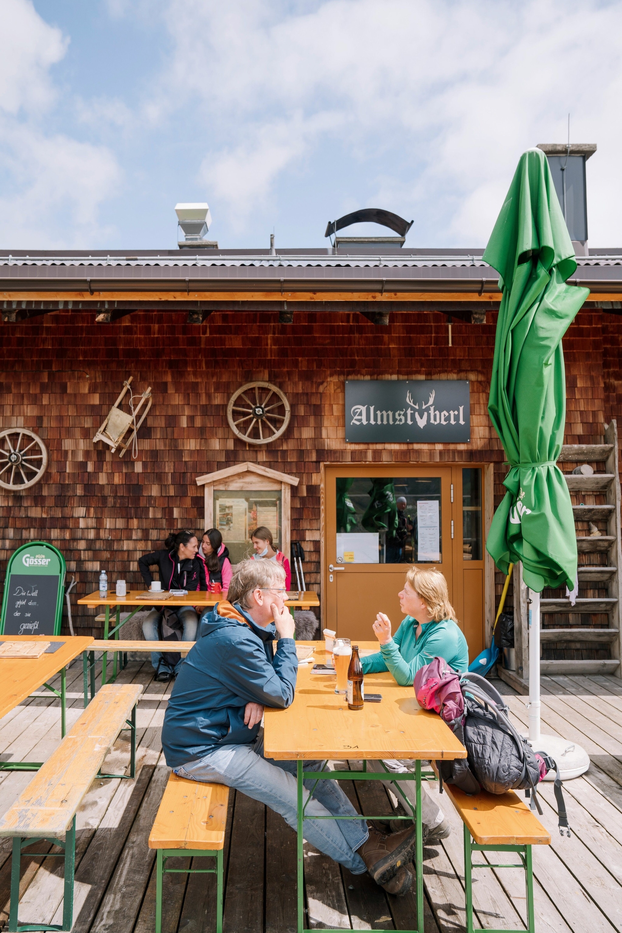 Hikers enjoying lunch at Almstüberl