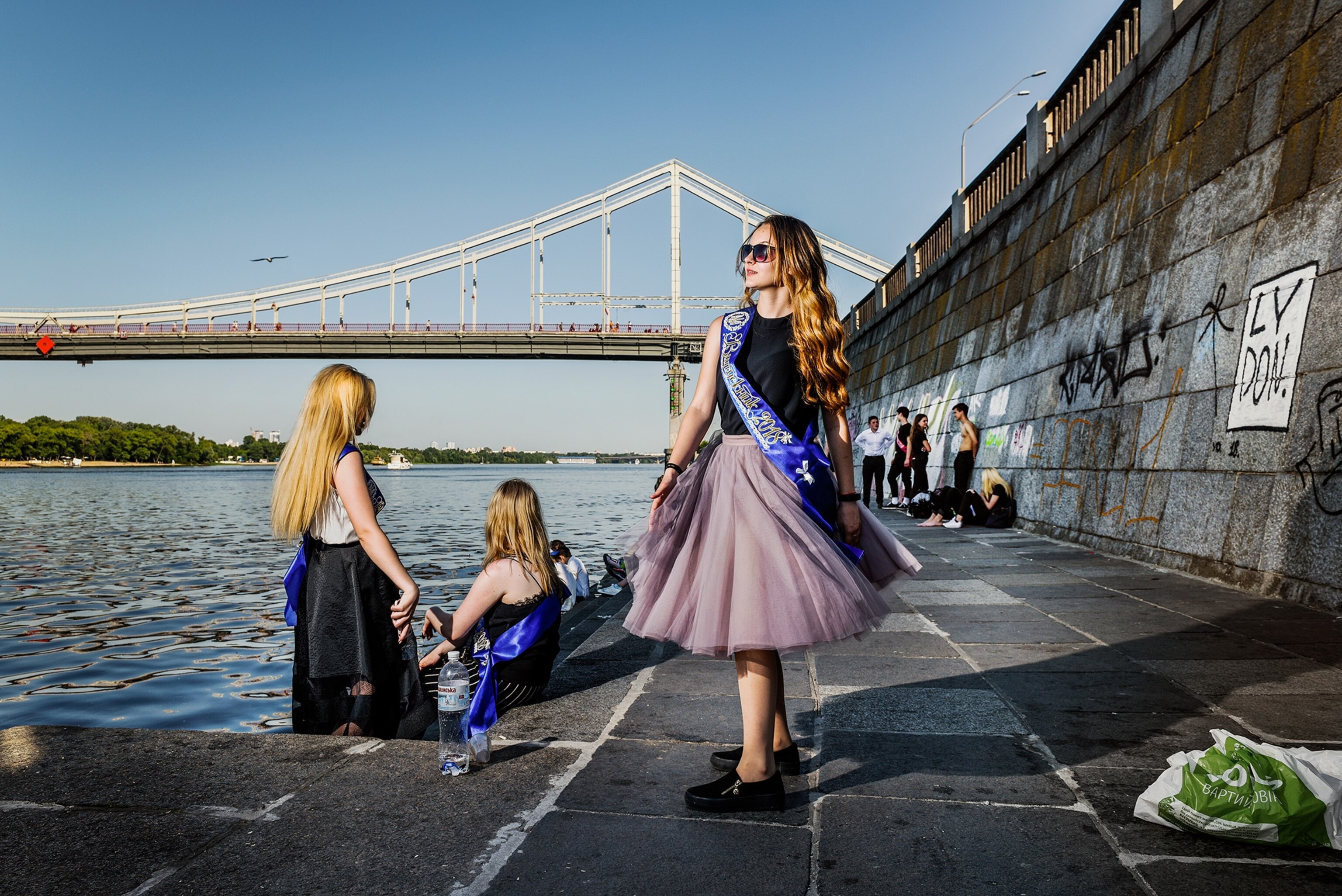 kids hanging by the Dnepr River after the last day of school in Kiev, Ukraine