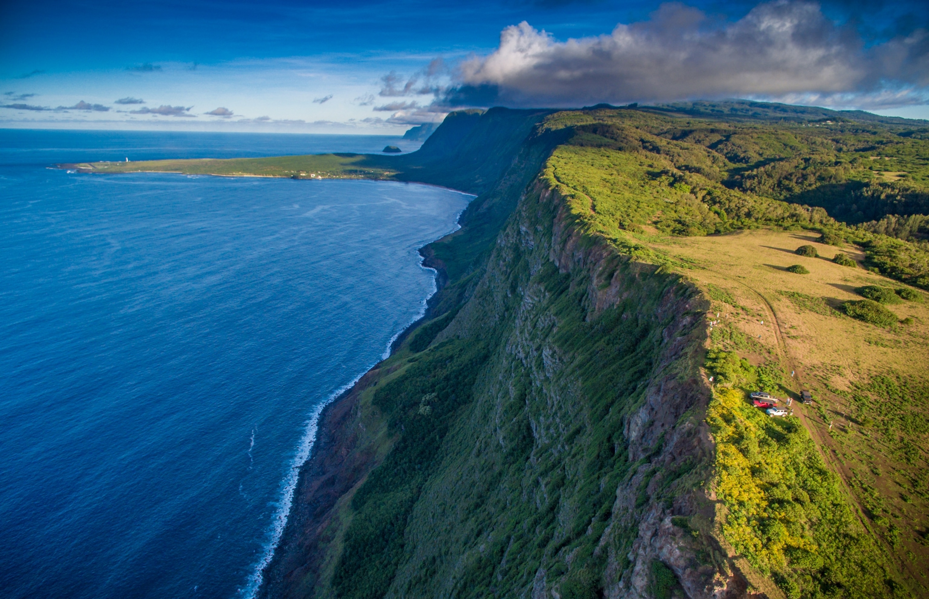 Naiwa Cliffs on Molokai's North Shore with kalaupapa peninsula jutting into the sea.