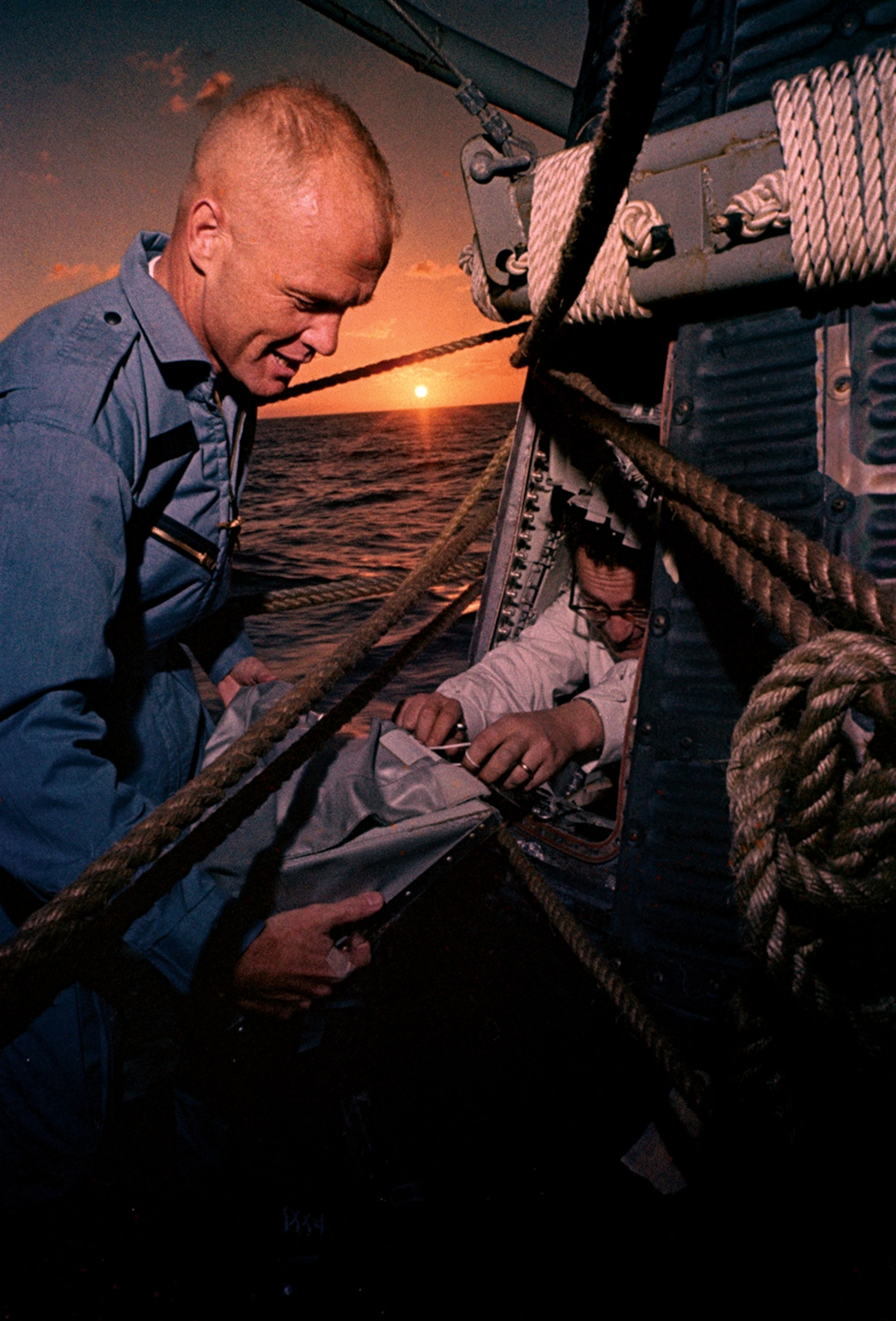 John Glenn unloading his capsule