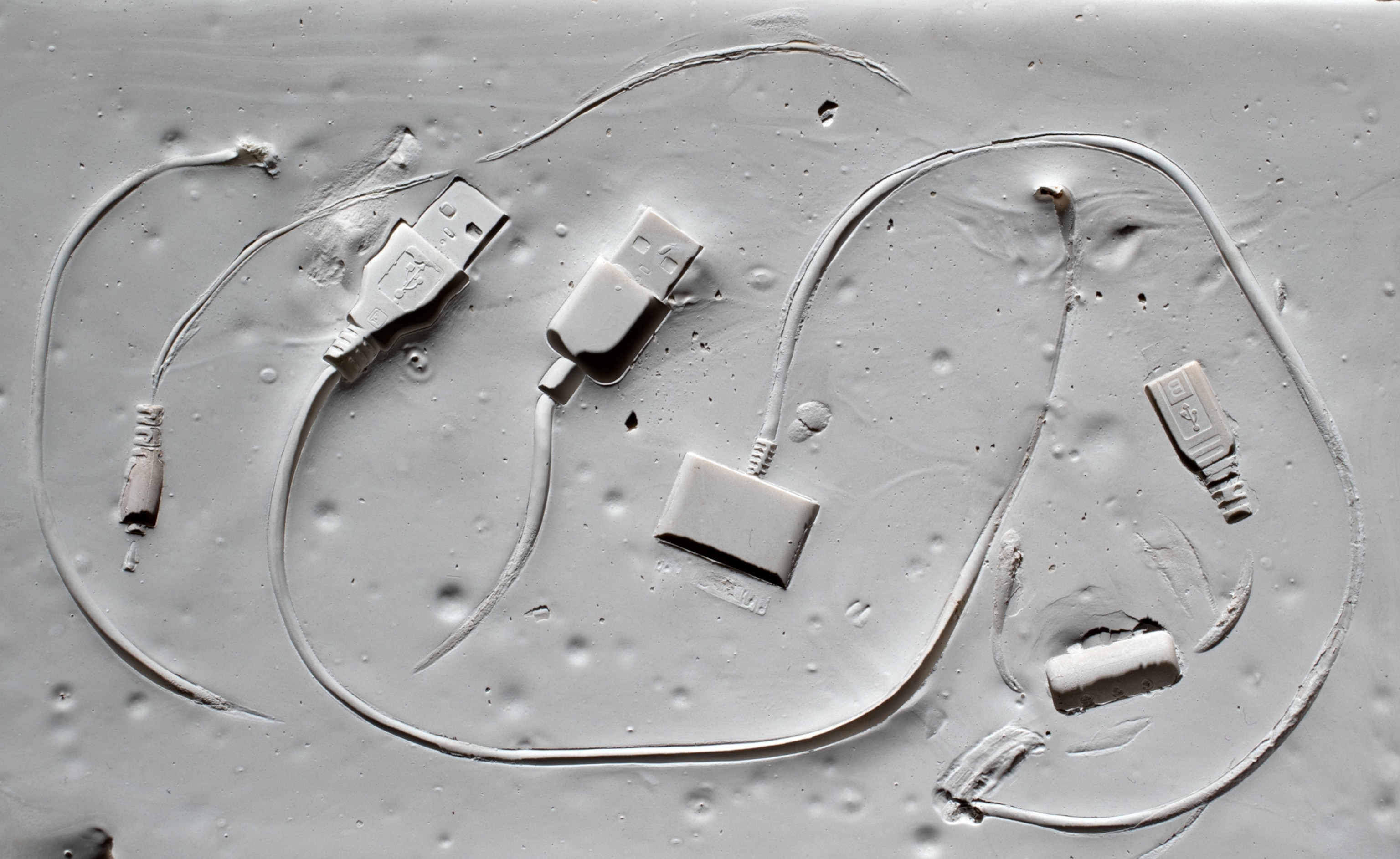 The imprints of USB cables on a mock fossil