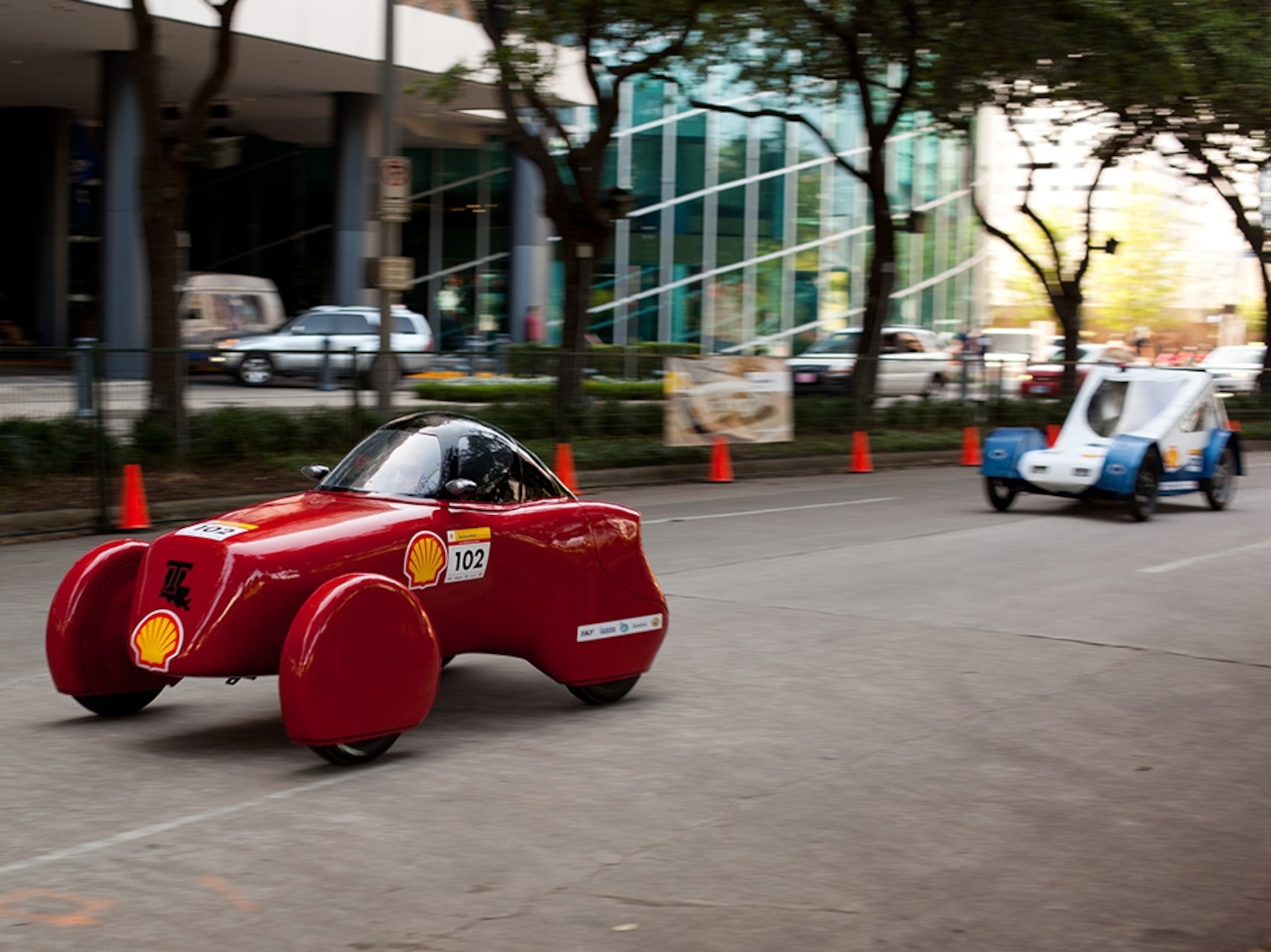 Louisiana Tech's Urban Concept car runs in front of the entry from Penn State. The Louisiana Tech entry led the gasoline division after the first day of the Eco-marathon.