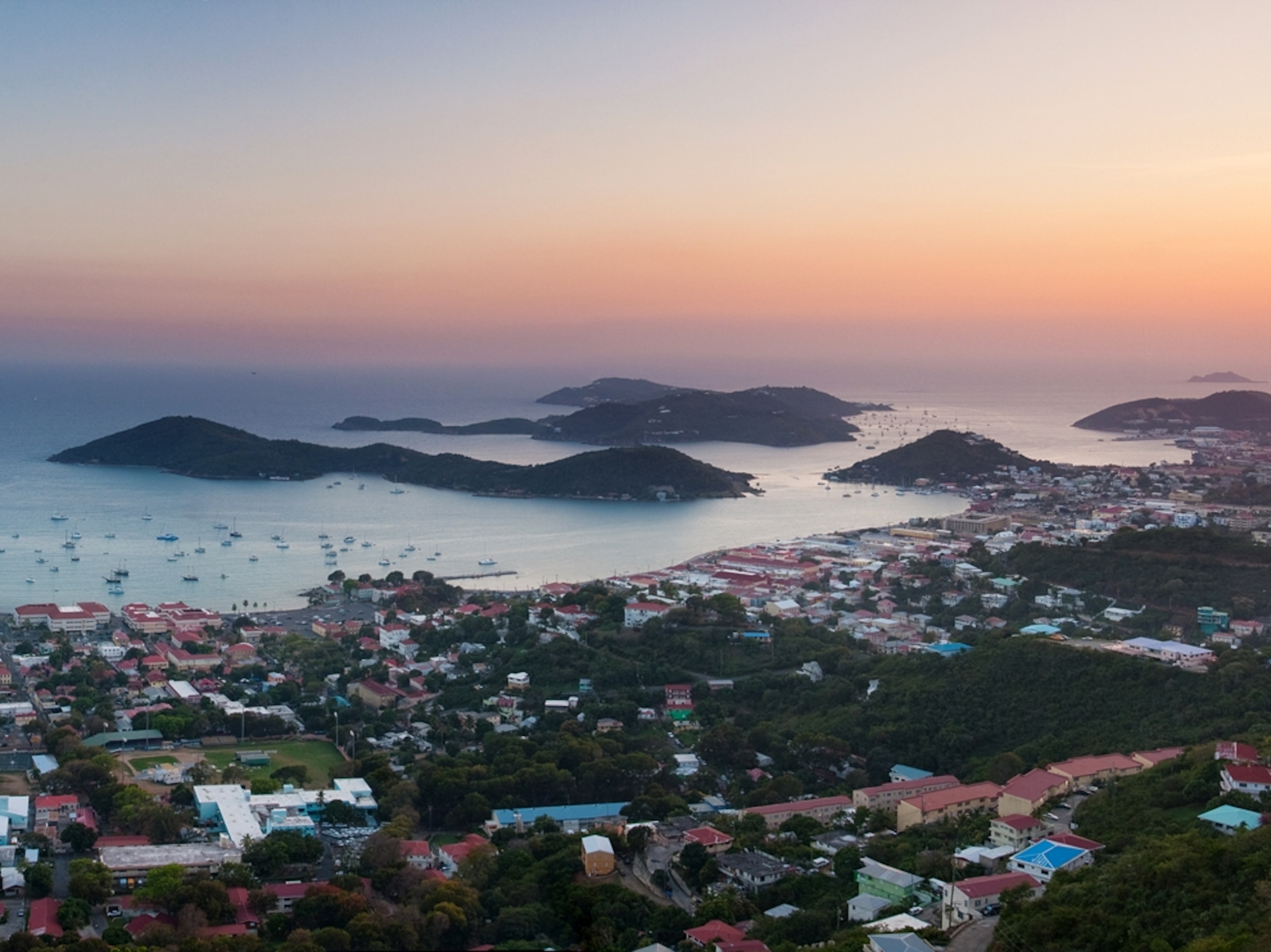 The sun sets on the city of Charlotte Amalie in the Caribbean