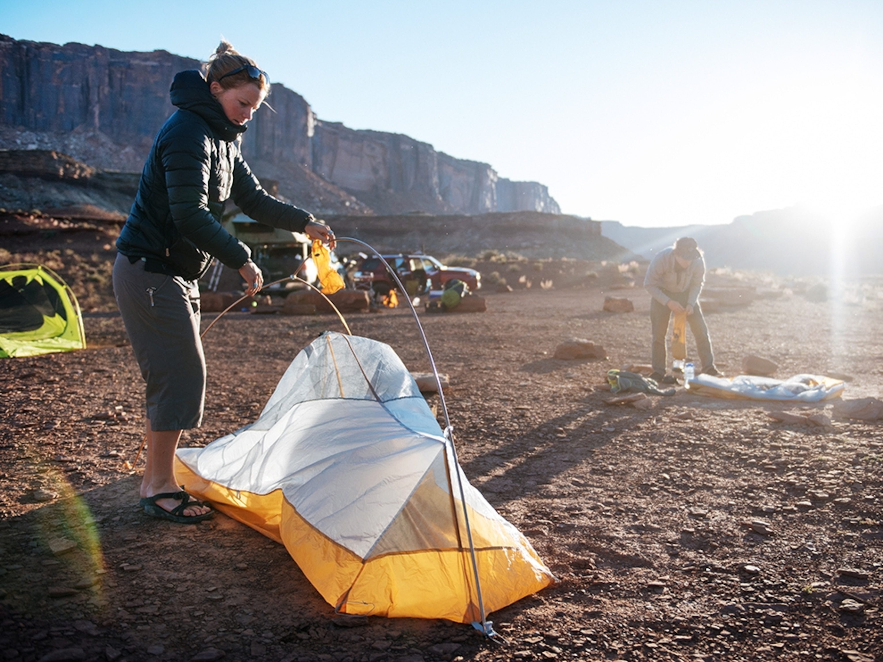 a group of adventurers setting up camp in Utah.