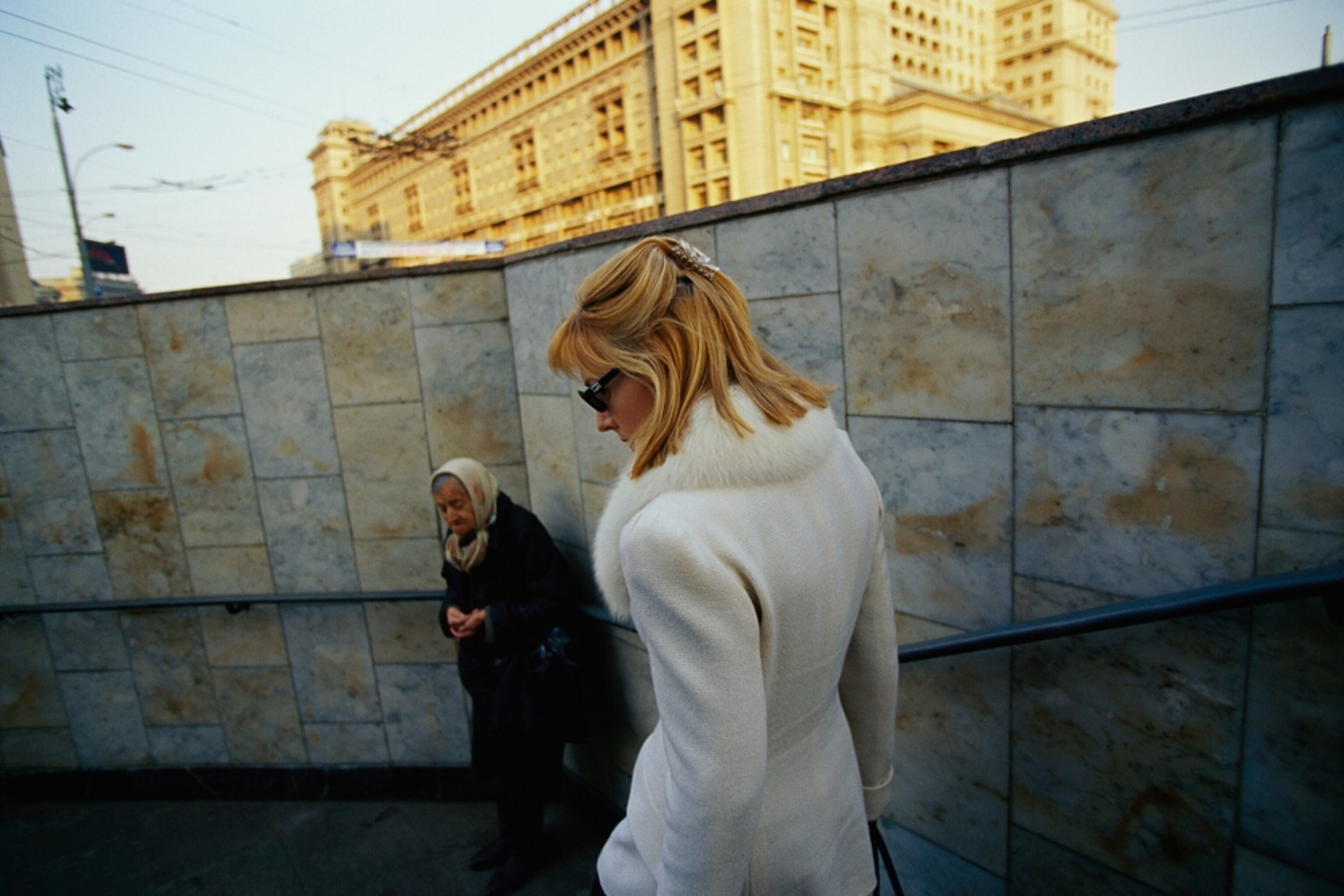 a woman descending outdoor steps in Moscow, Russia