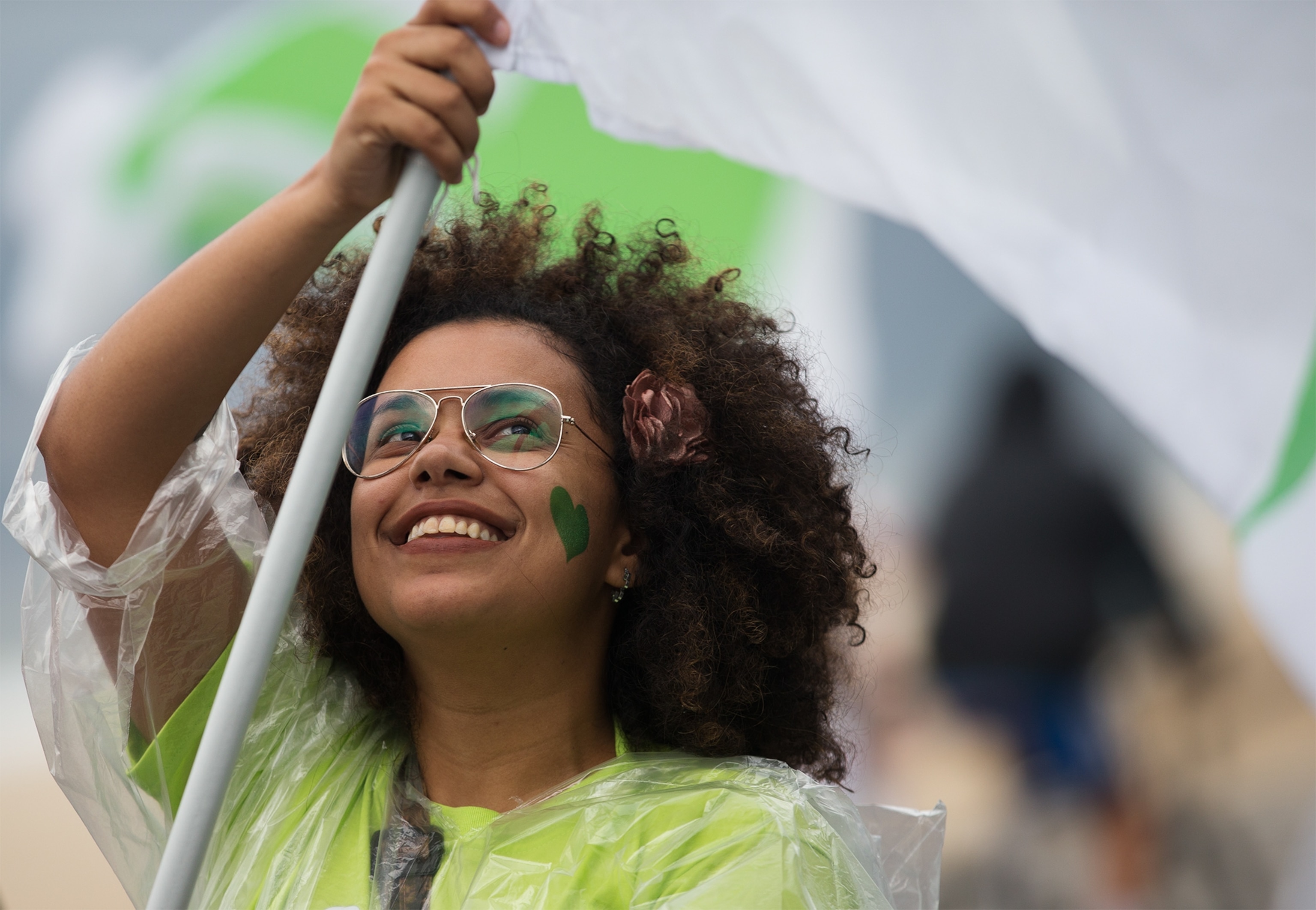a woman in Brazil participating in the People's Climate March