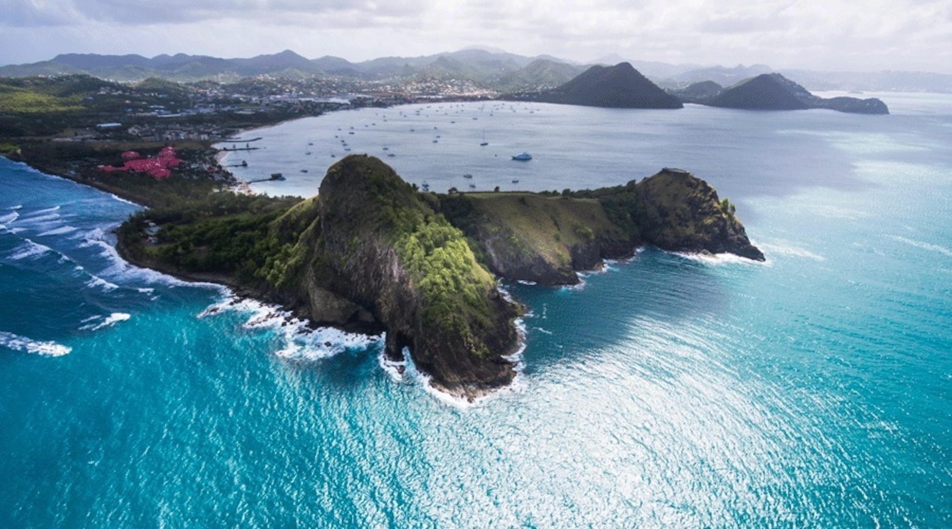The horseshoe-shaped Rodney Bay, with the Trouya Peninsula jutting out behind (top right).