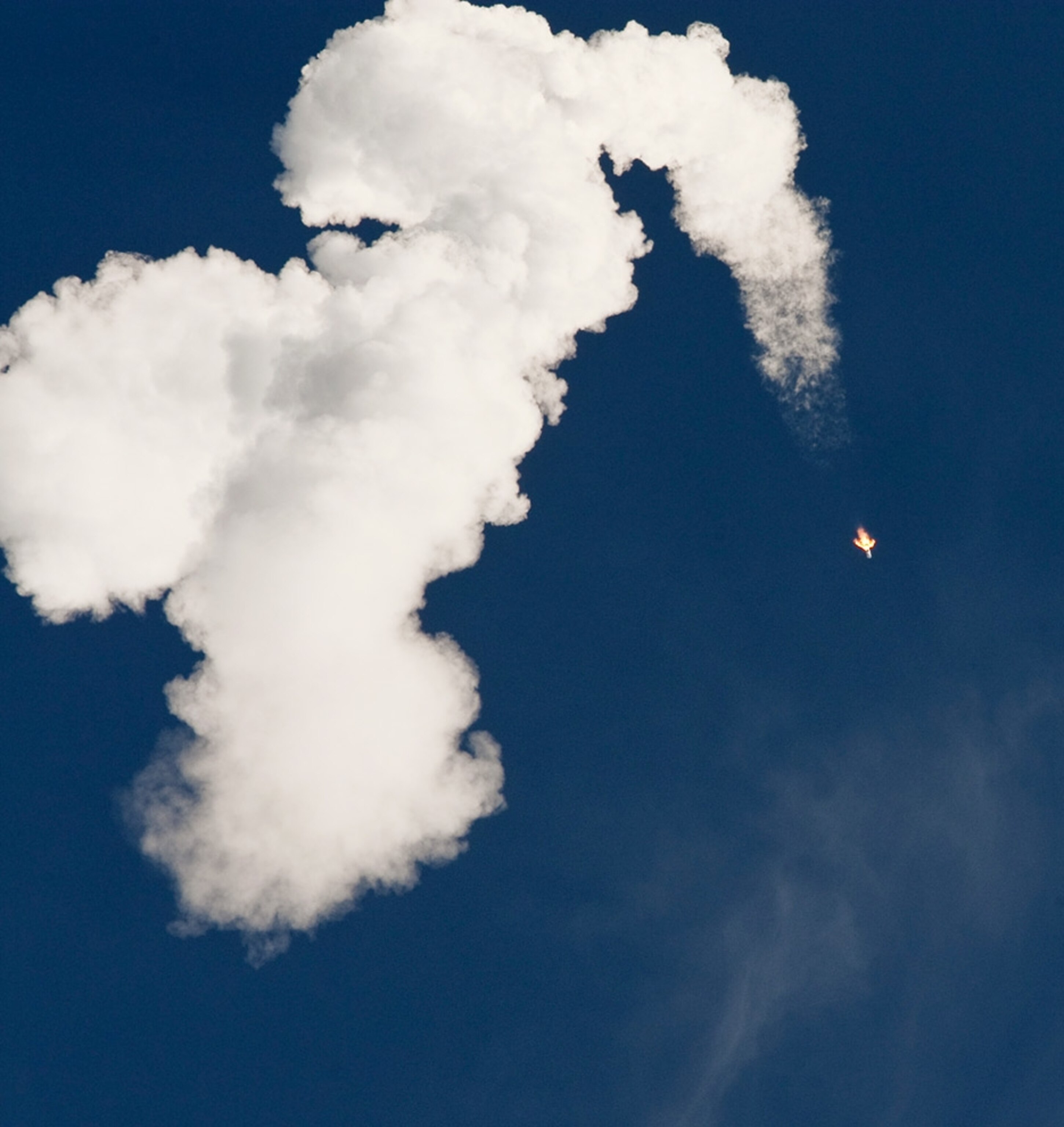 Exhaust from an Atlas V rocket fills the sky during the launch of NASA's new Solar Dynamics Observatory