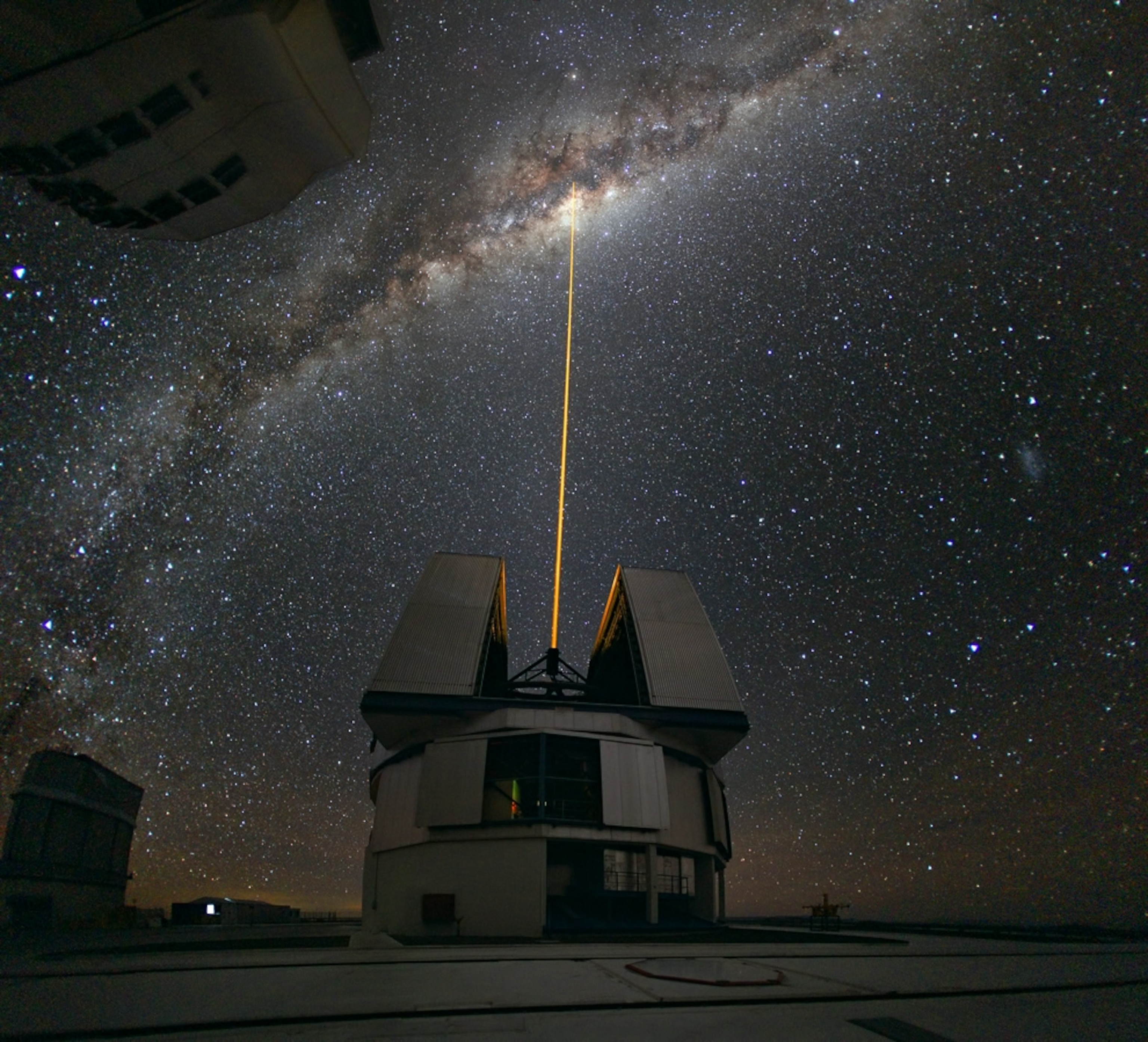 a laser piercing the Milky Way