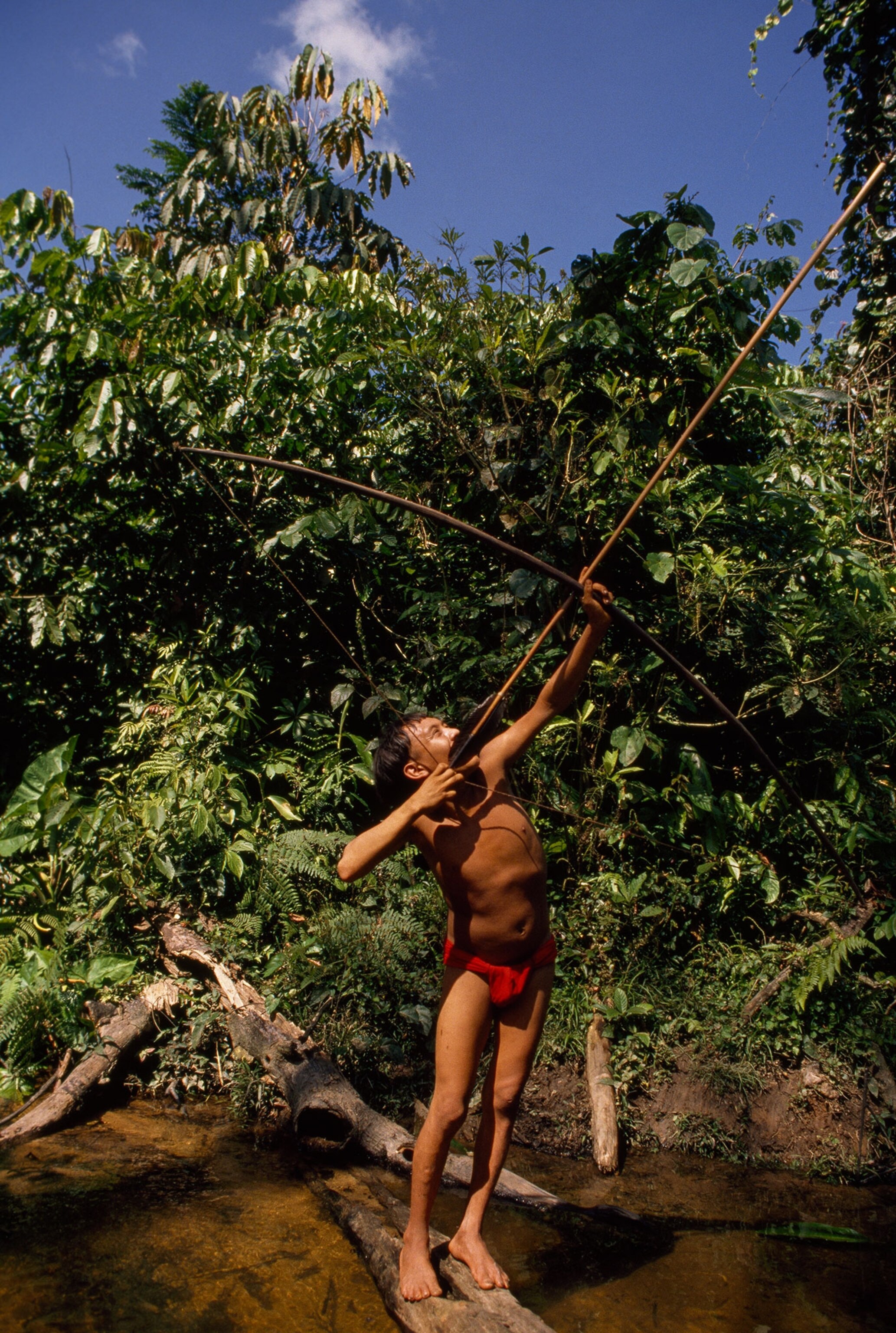 a Yanomami teenager hunting