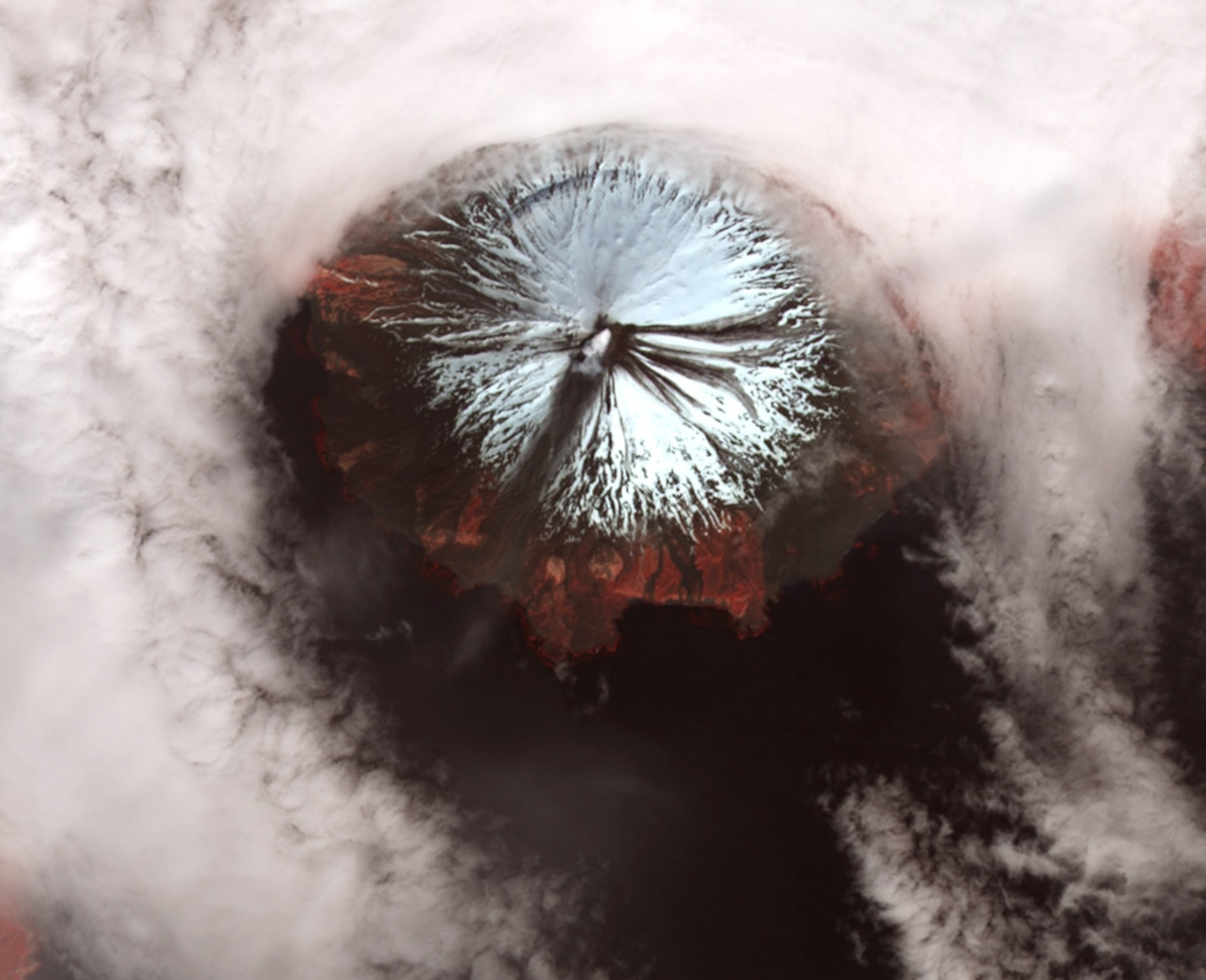 A satellite picture shows a small ash plume over the Mount Cleveland volcano in the Aleutian Islands of Alaska.