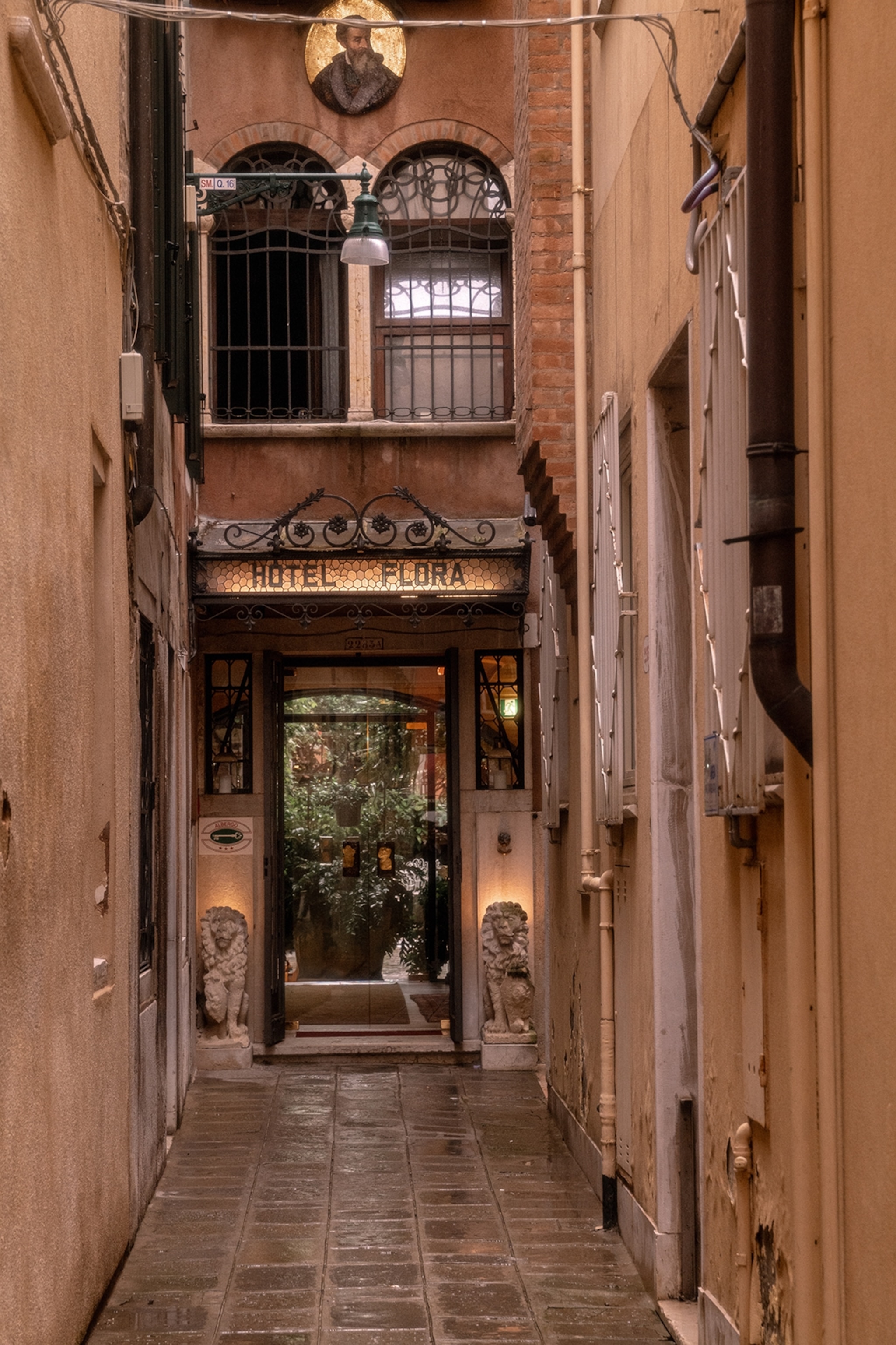 the exterior alley of a hotel in venice