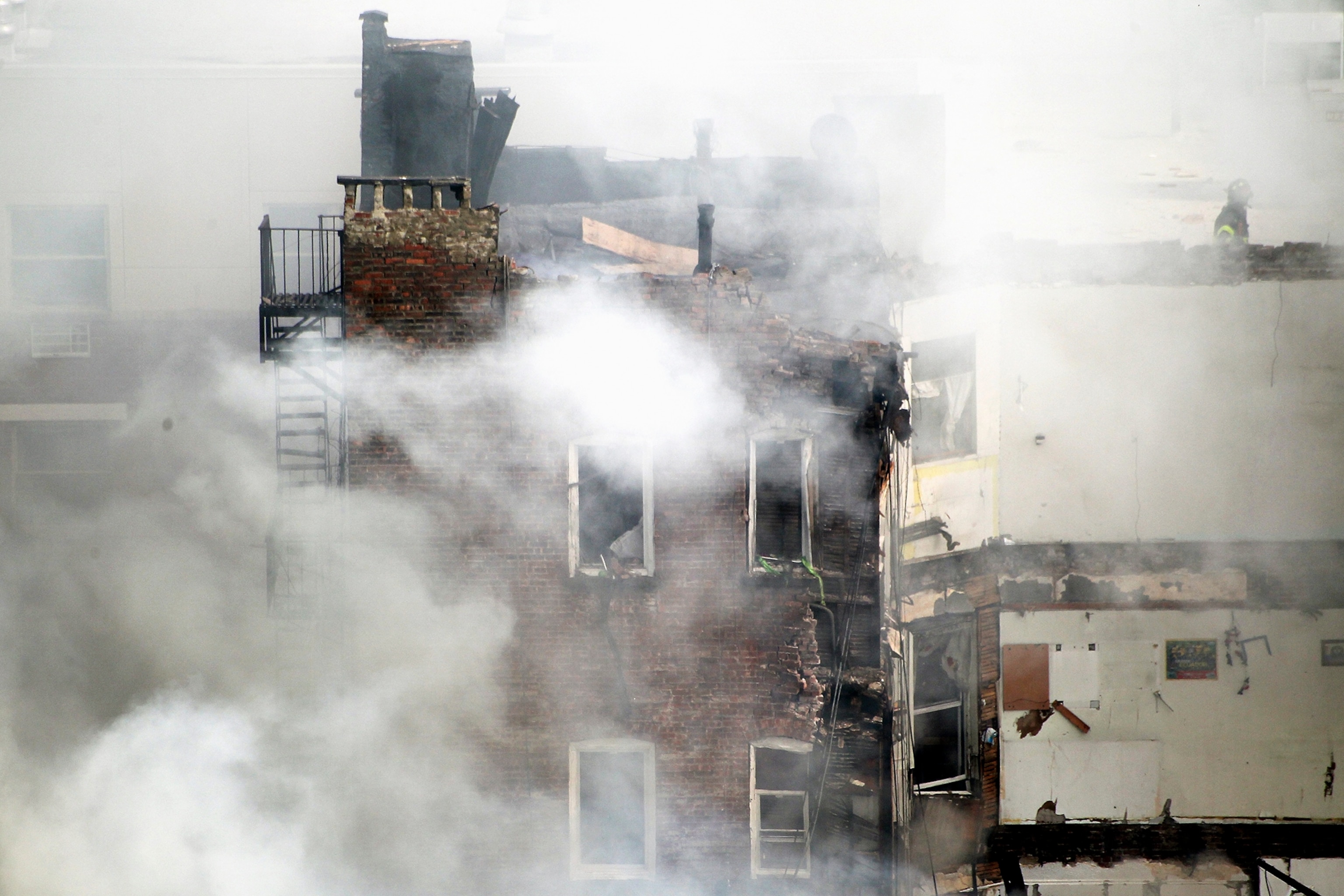 a building affected by the explosion in Harlem, New York.