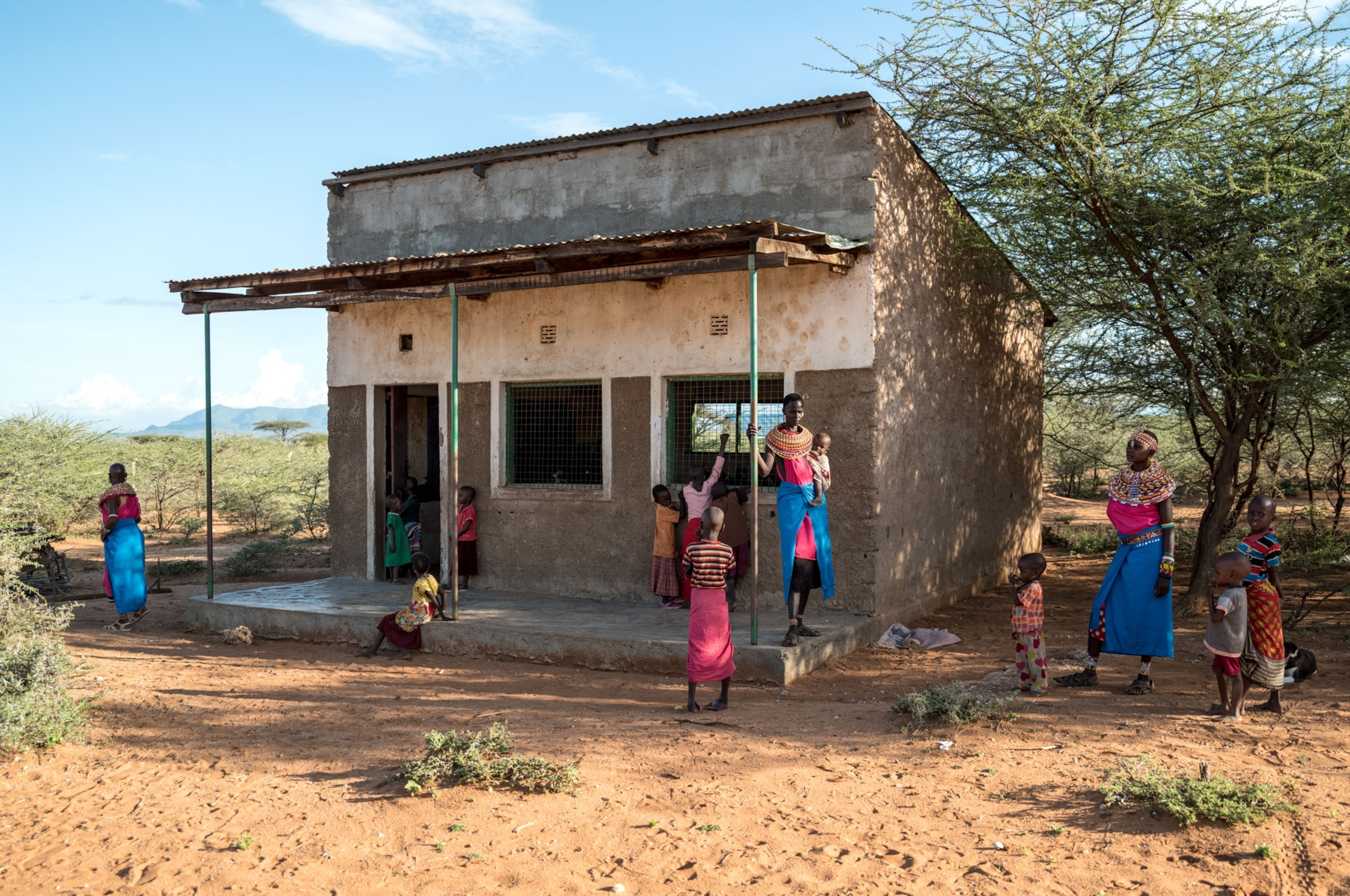 women outside of the school building