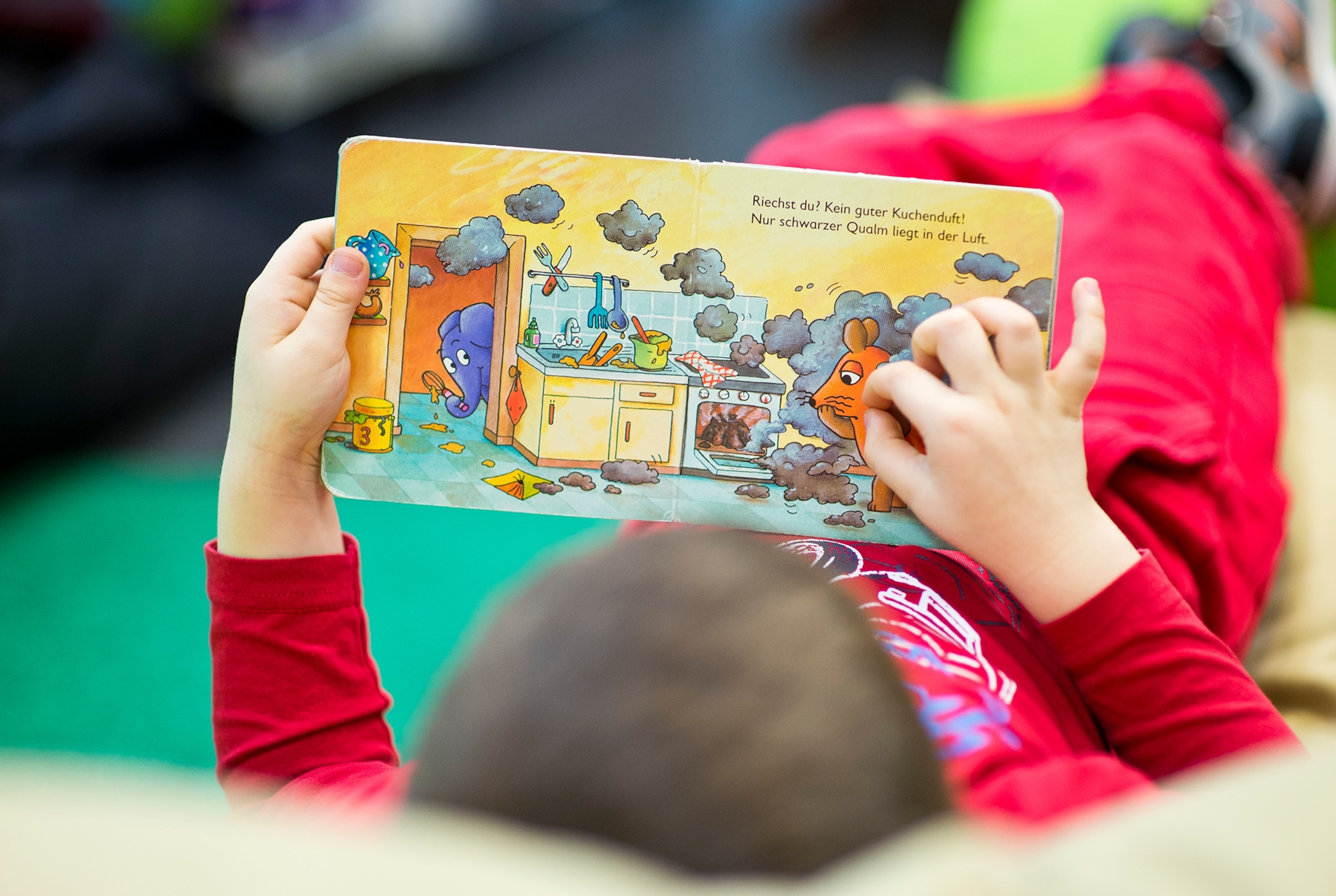 a children reading a book.