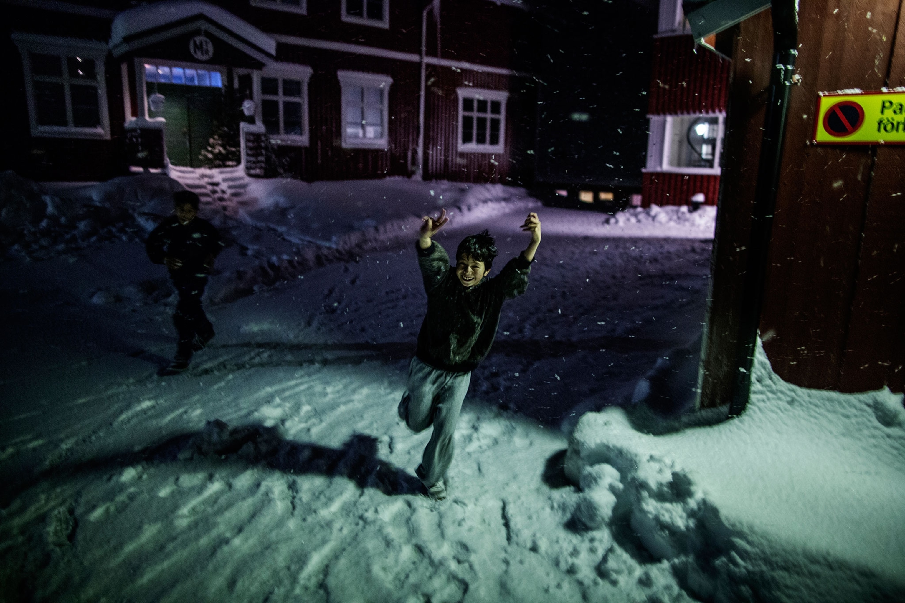kid running in snow