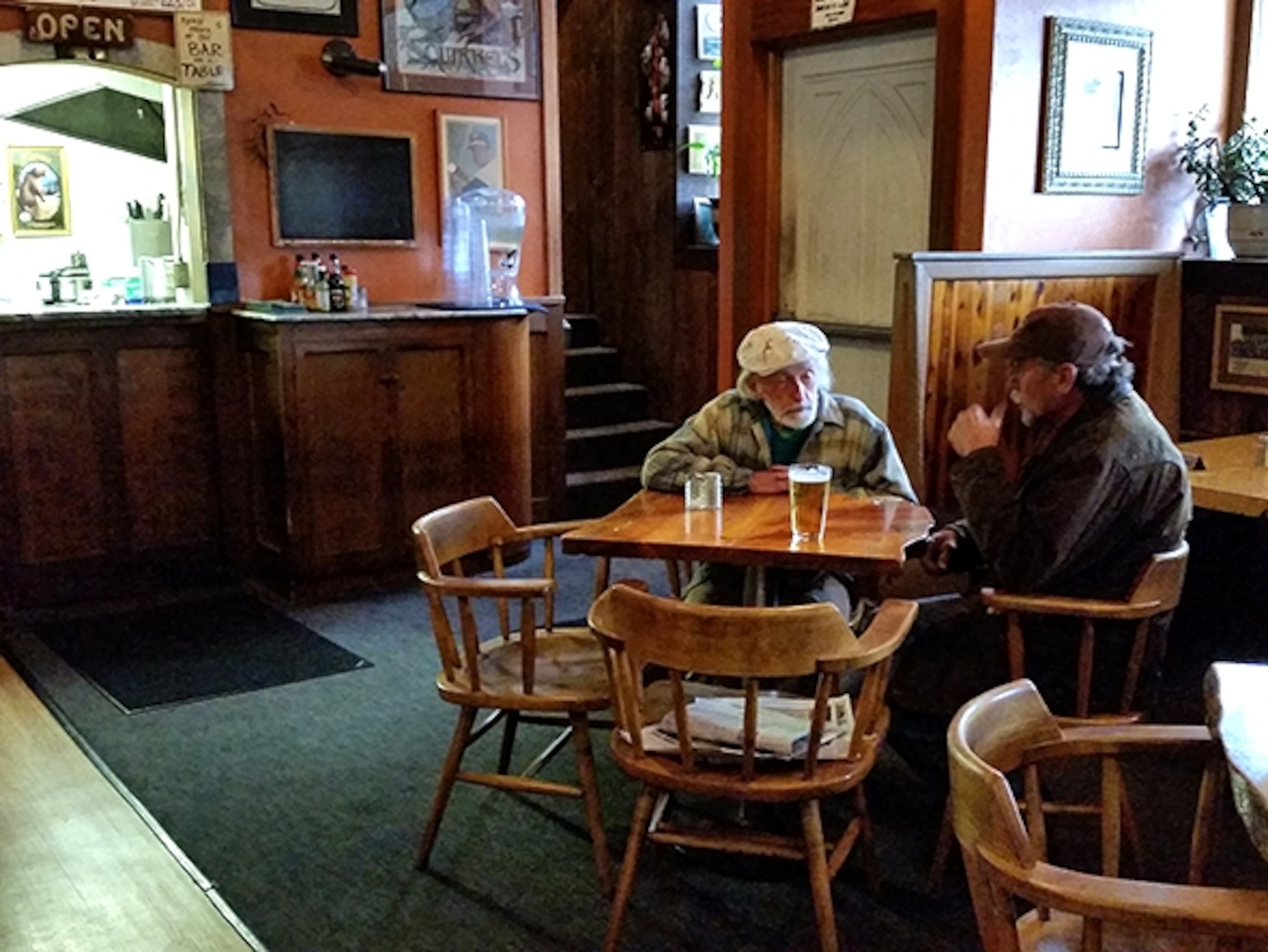 A few men dining at Squirrel's Tavern (Photograph by Robert Reid)