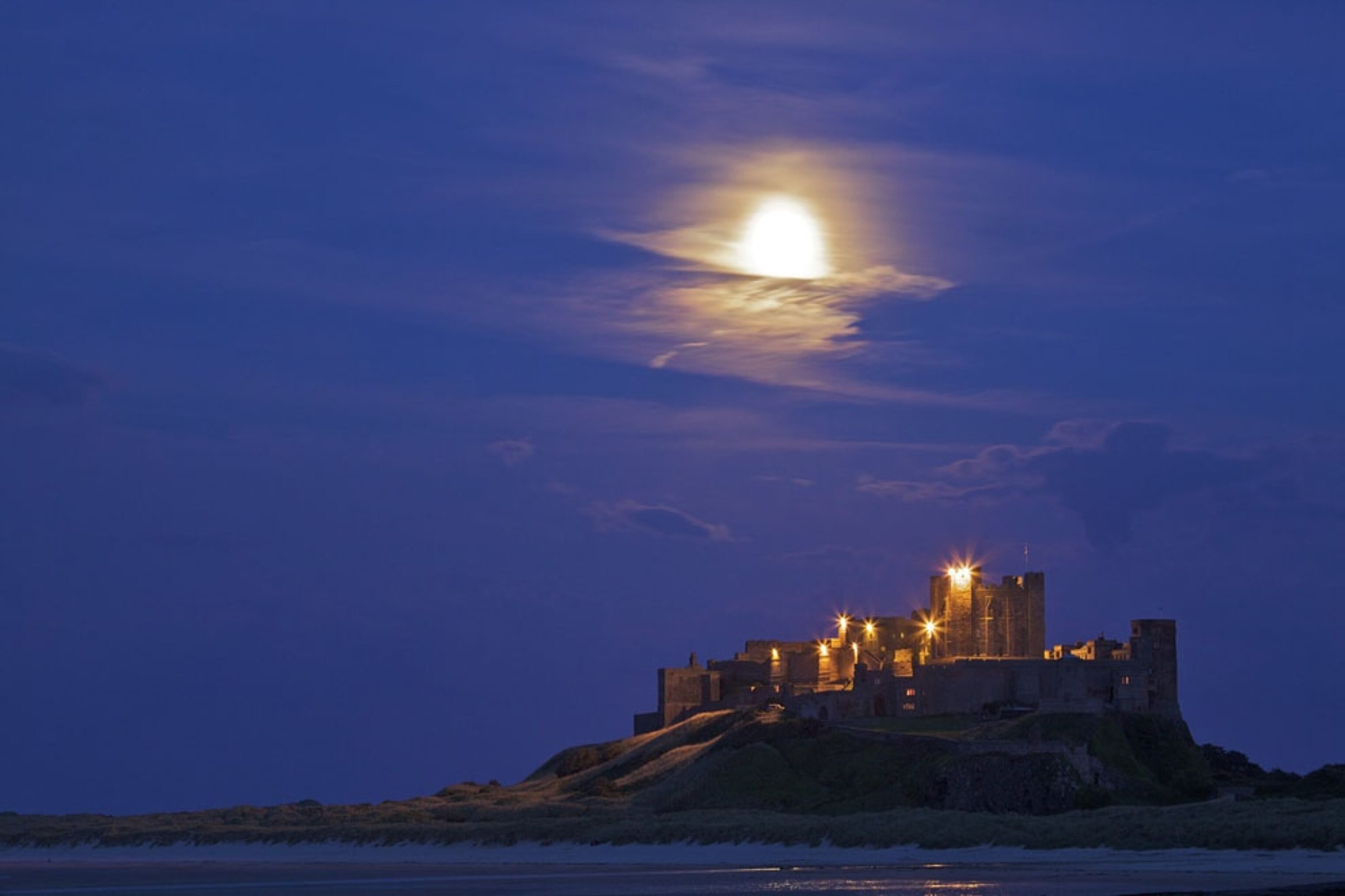 Castle in Northumberland at night