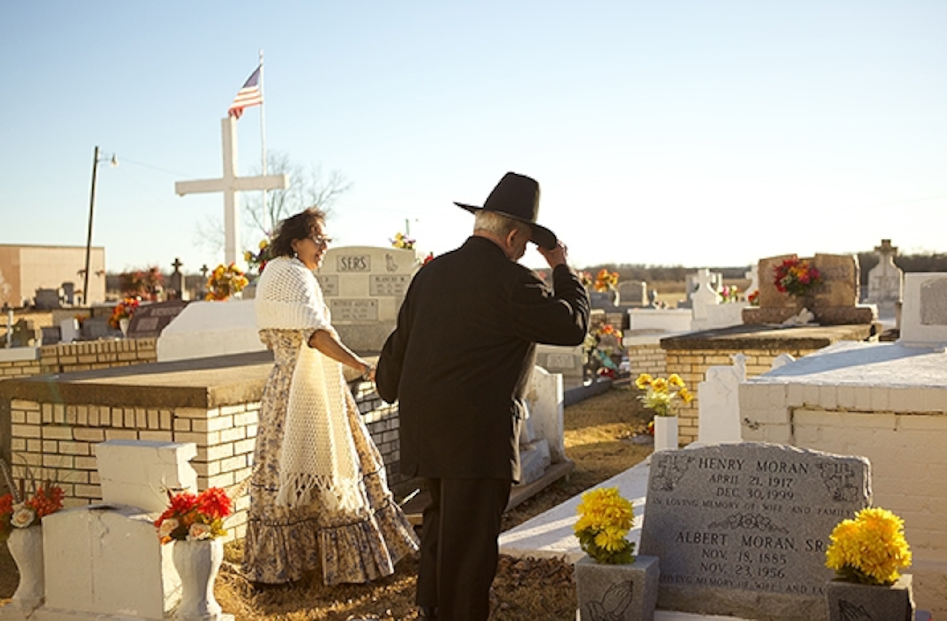 Creole culture endures here: Metoyer descendant Betty Metoyer Roque and husband Charles Roque visit his father's grave. (Photograph by Kris Davidson)