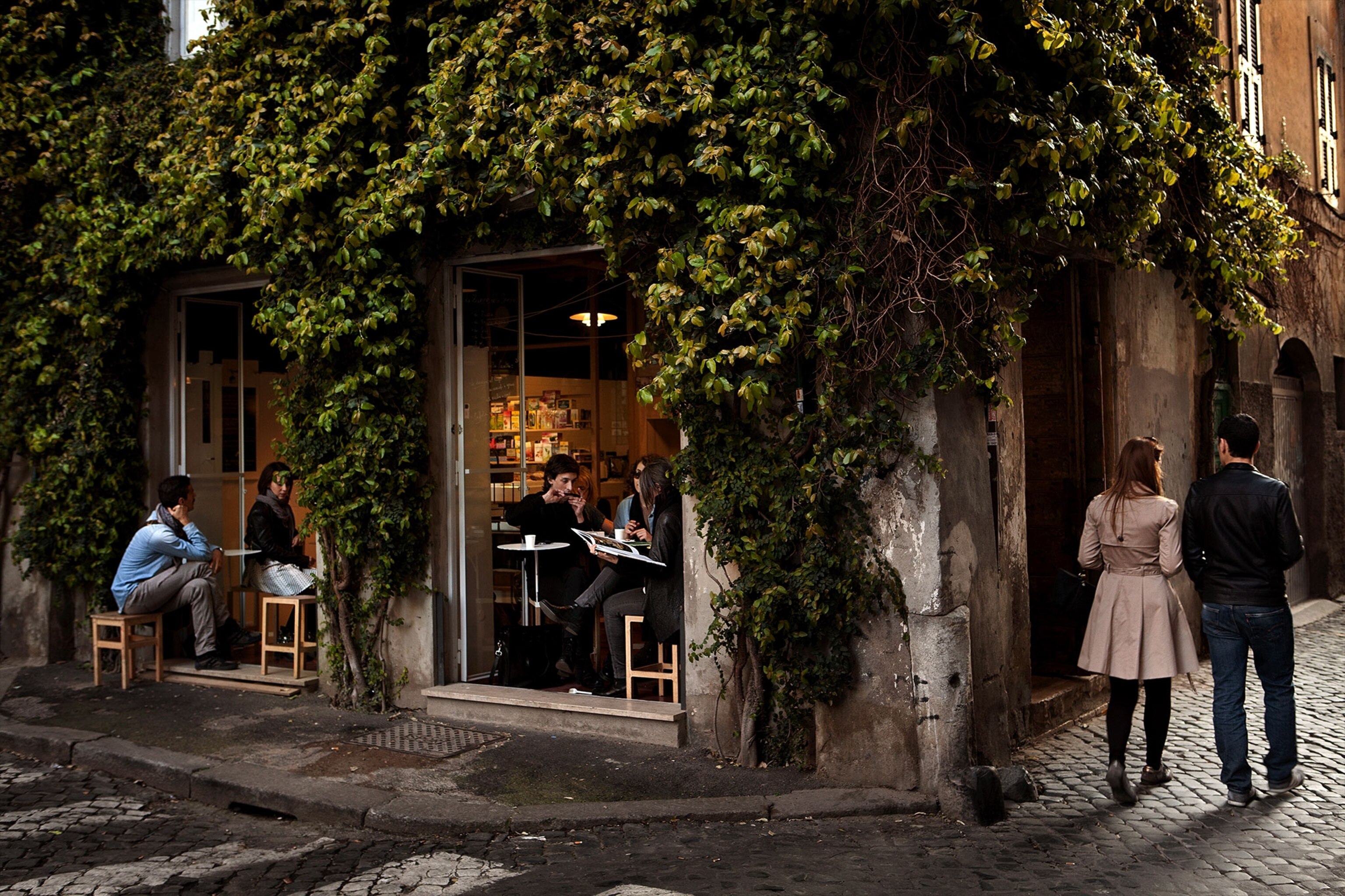people walking outside a restaurant in Rome, Italy