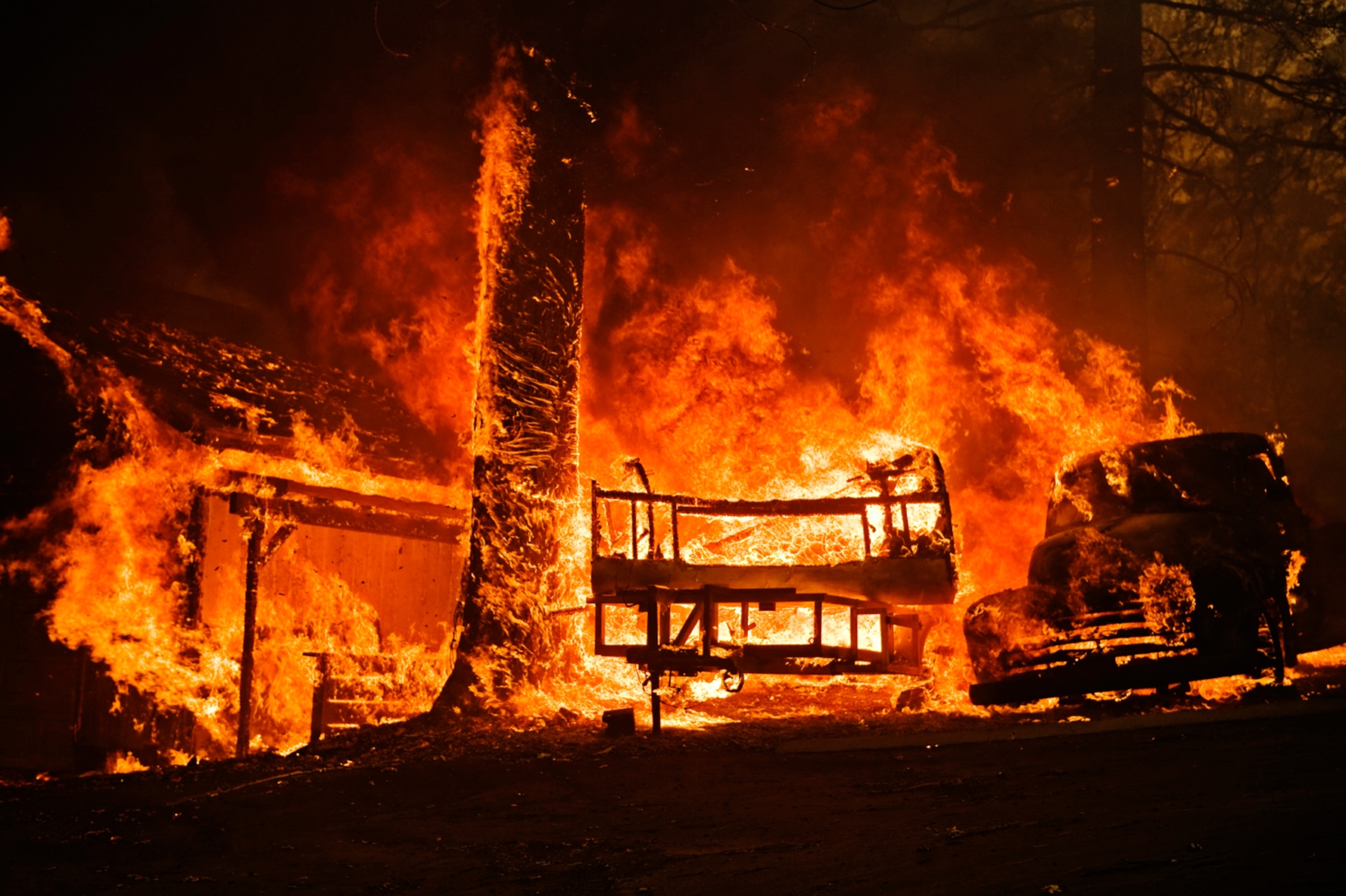 Homes burn in the Smiley Park neighborhood of Running Springs, CA during the Slide Fire in 2007.