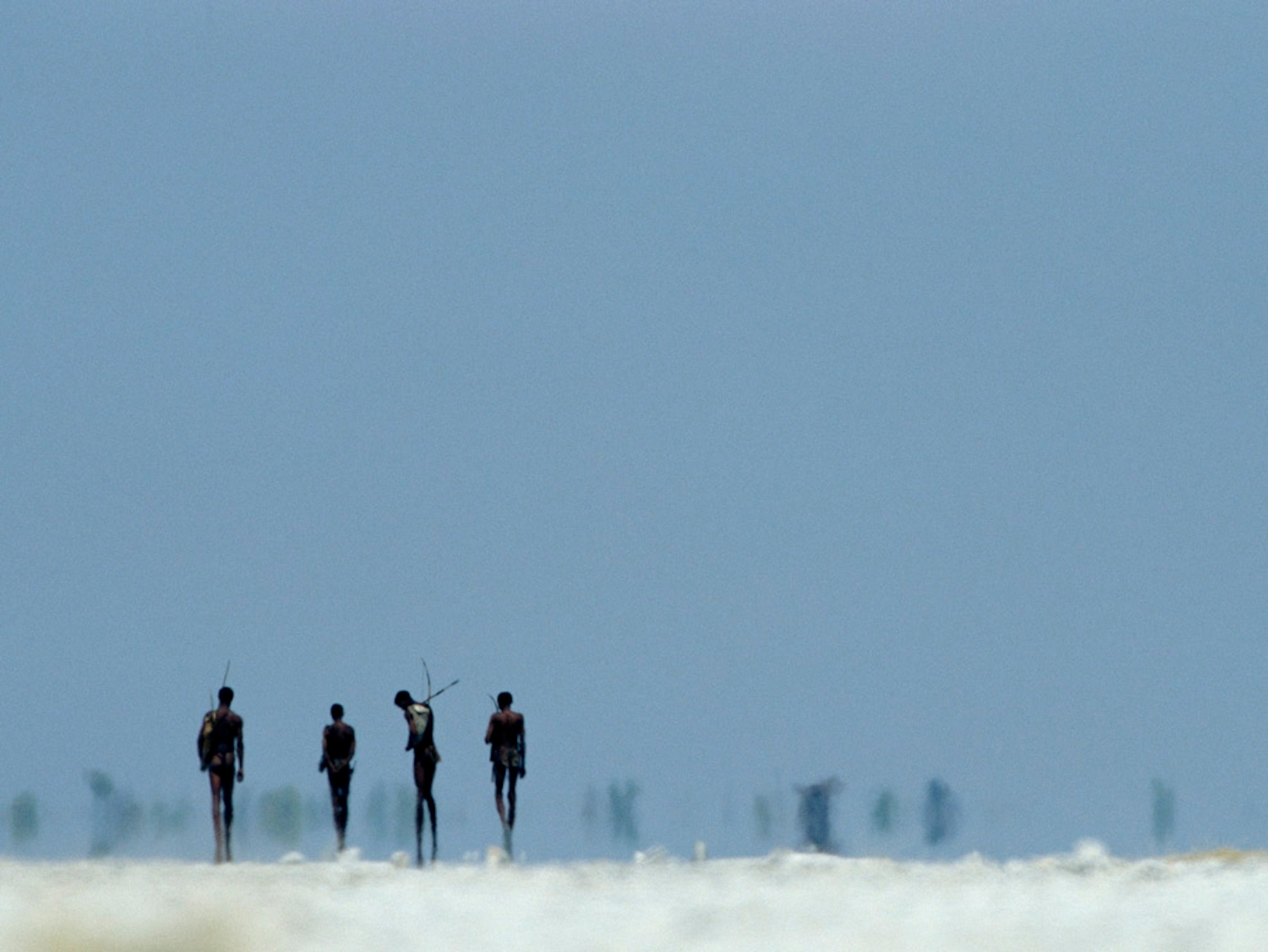 Four Bushmen head out to hunt