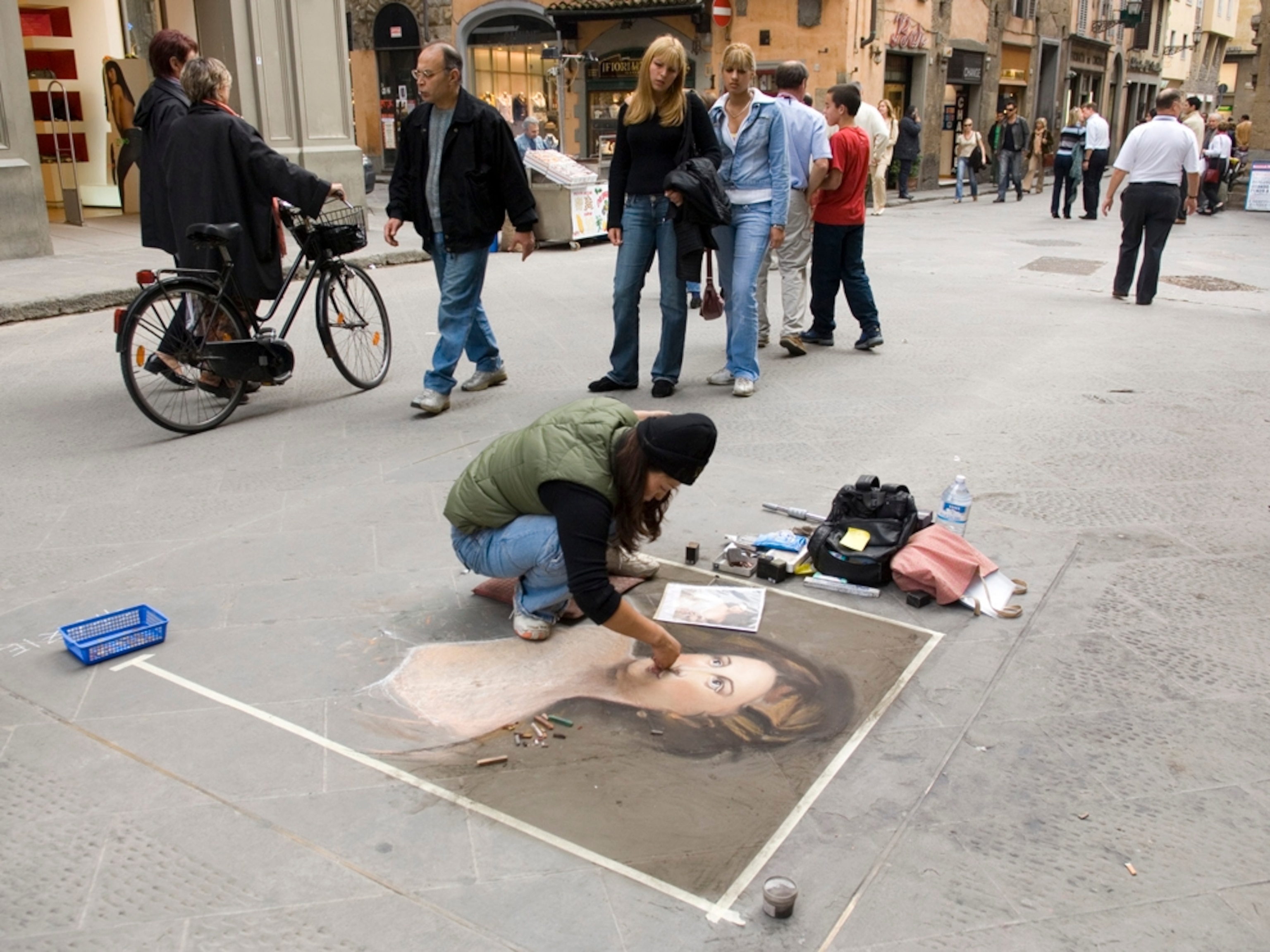 Street artist works with chalk, Florence, Italy