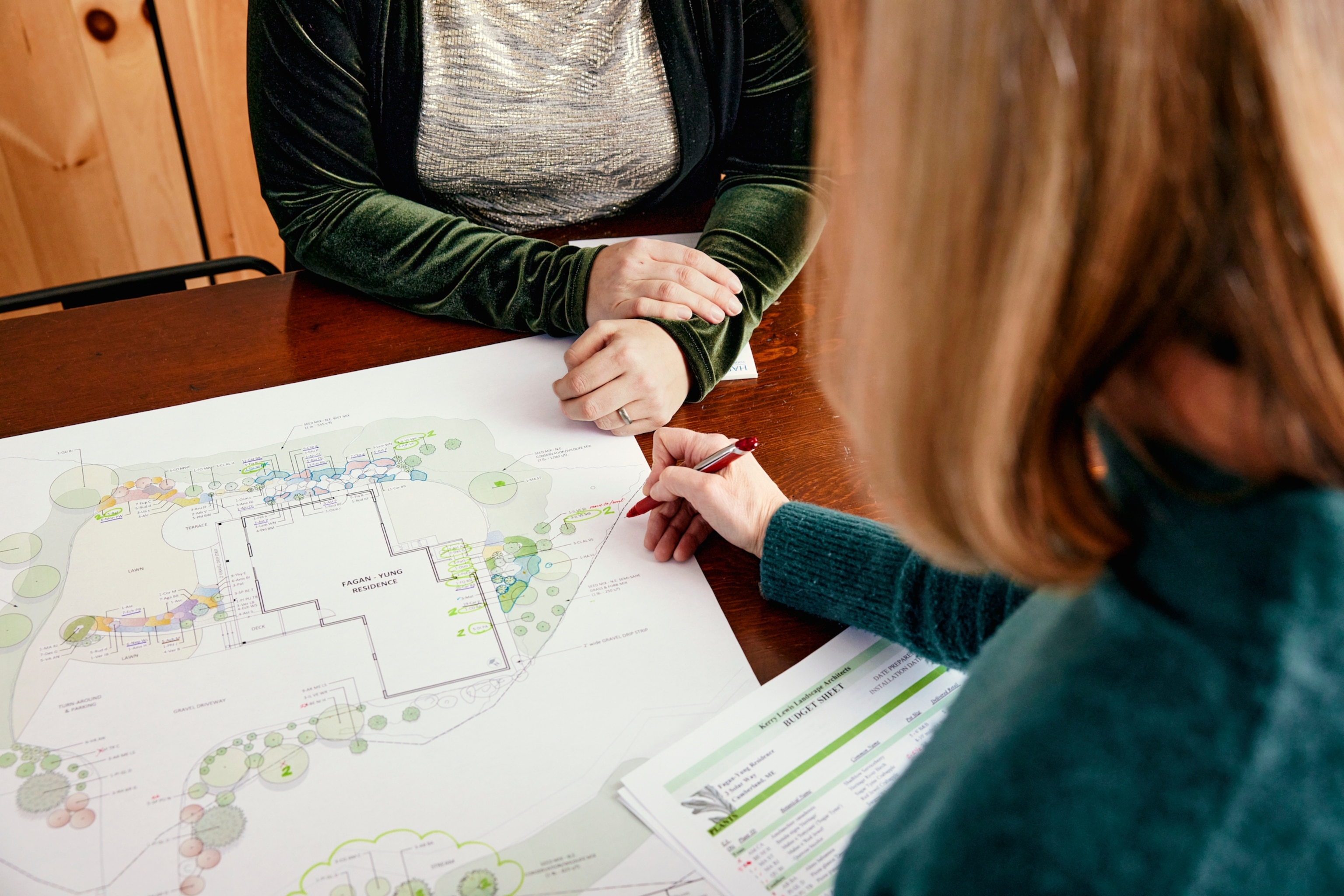 Image of architects designing blue-print of energy-efficient home