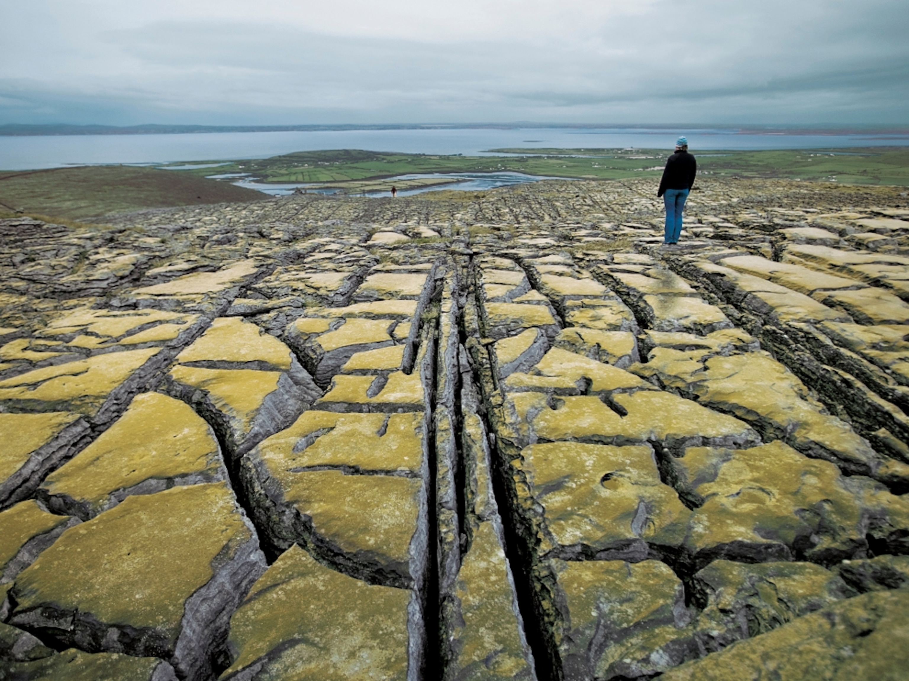a woman standing on the Burren, County Clare, Ireland