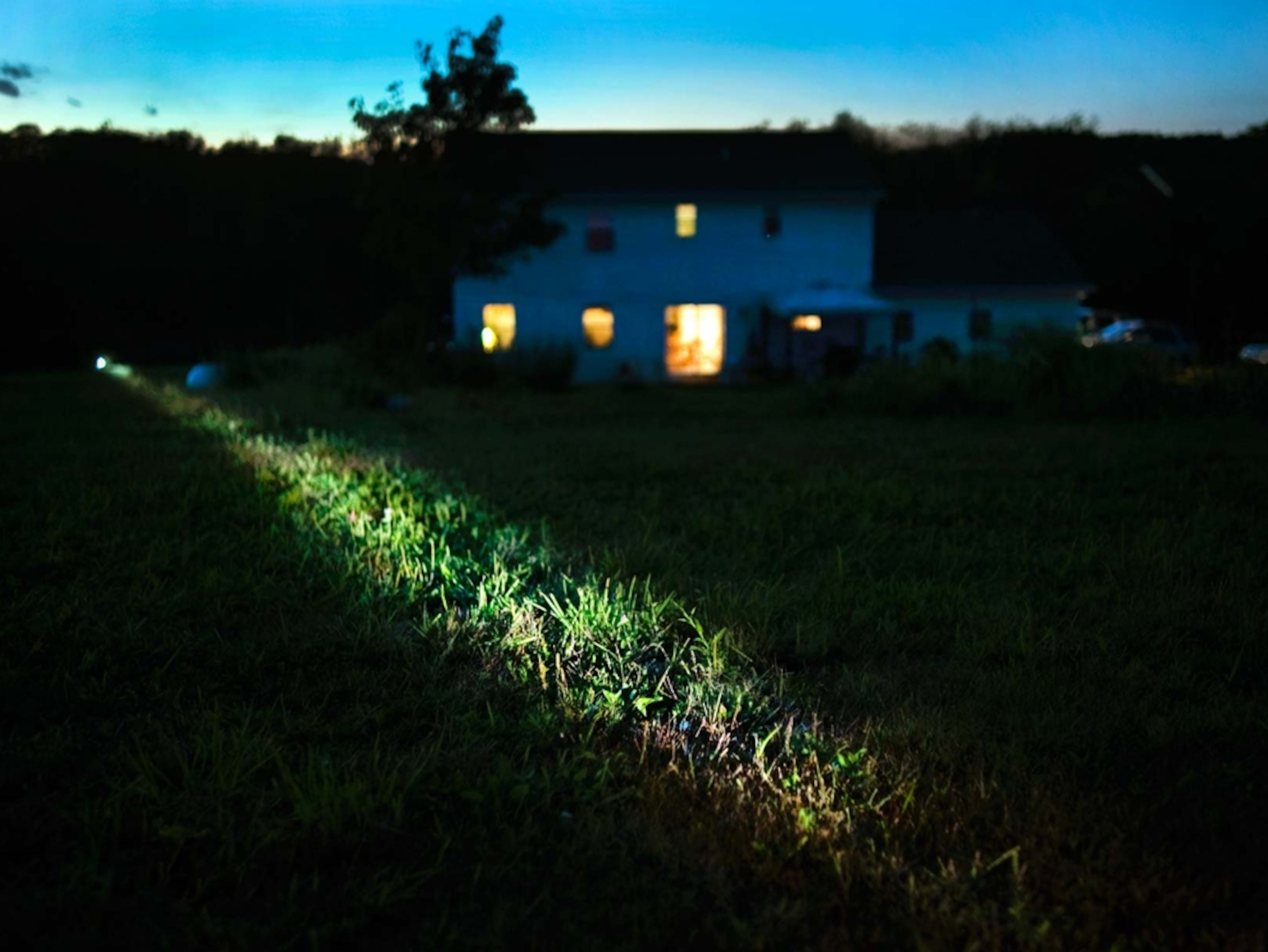 Lights from a monitor to measure air quality illuminate the Hallowich family's property in southwestern Pennsylvania