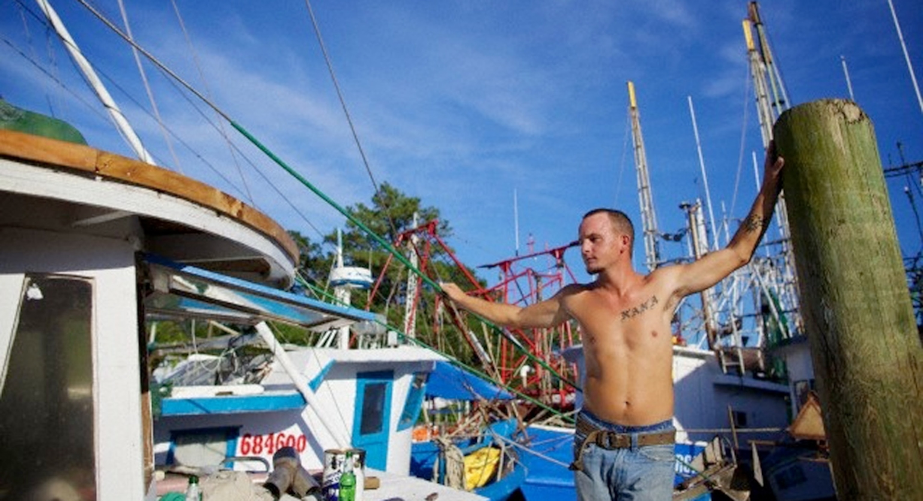 A man on a dock on Bayou La Batre, Alabama