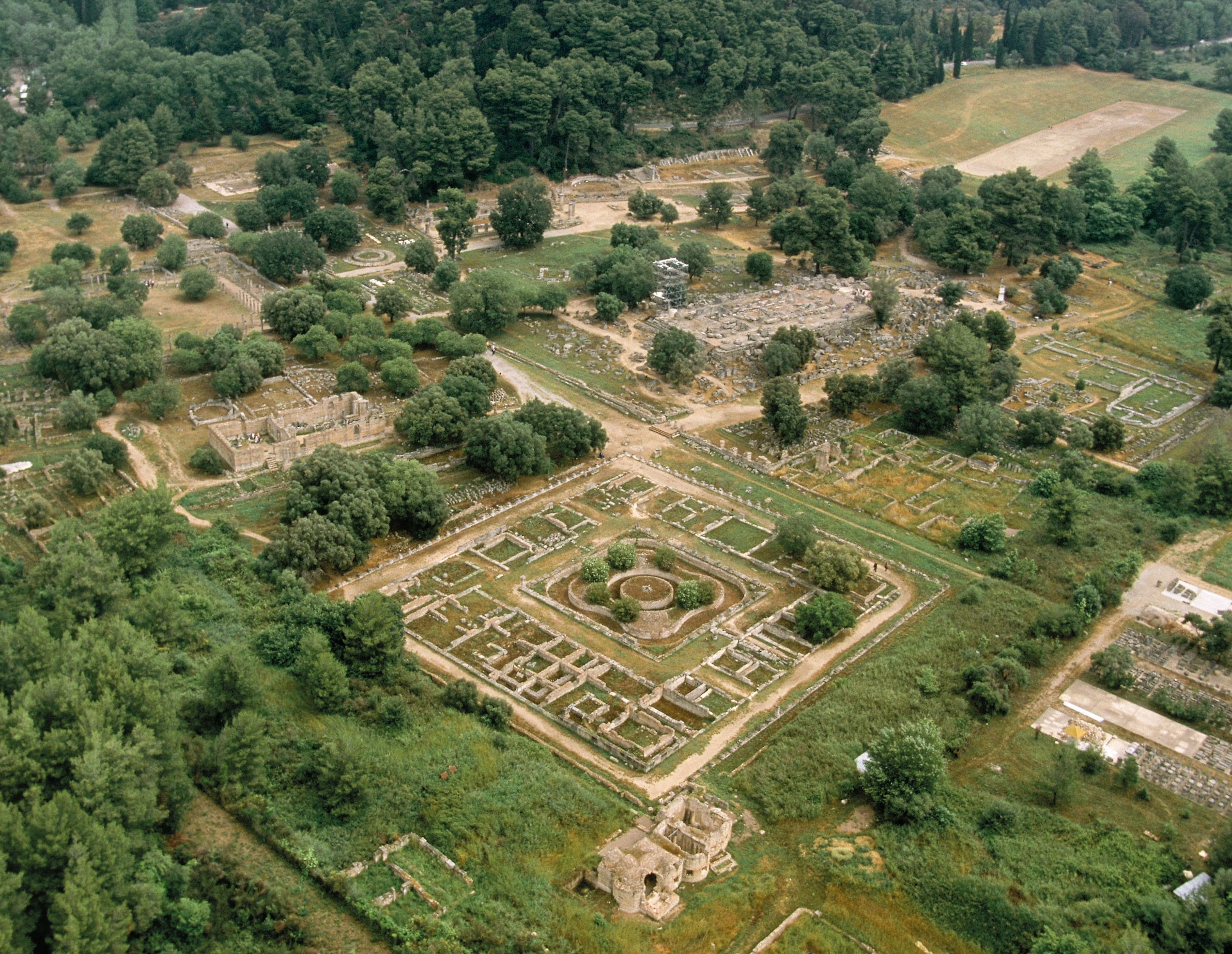 ruins in a green shrub filled field
