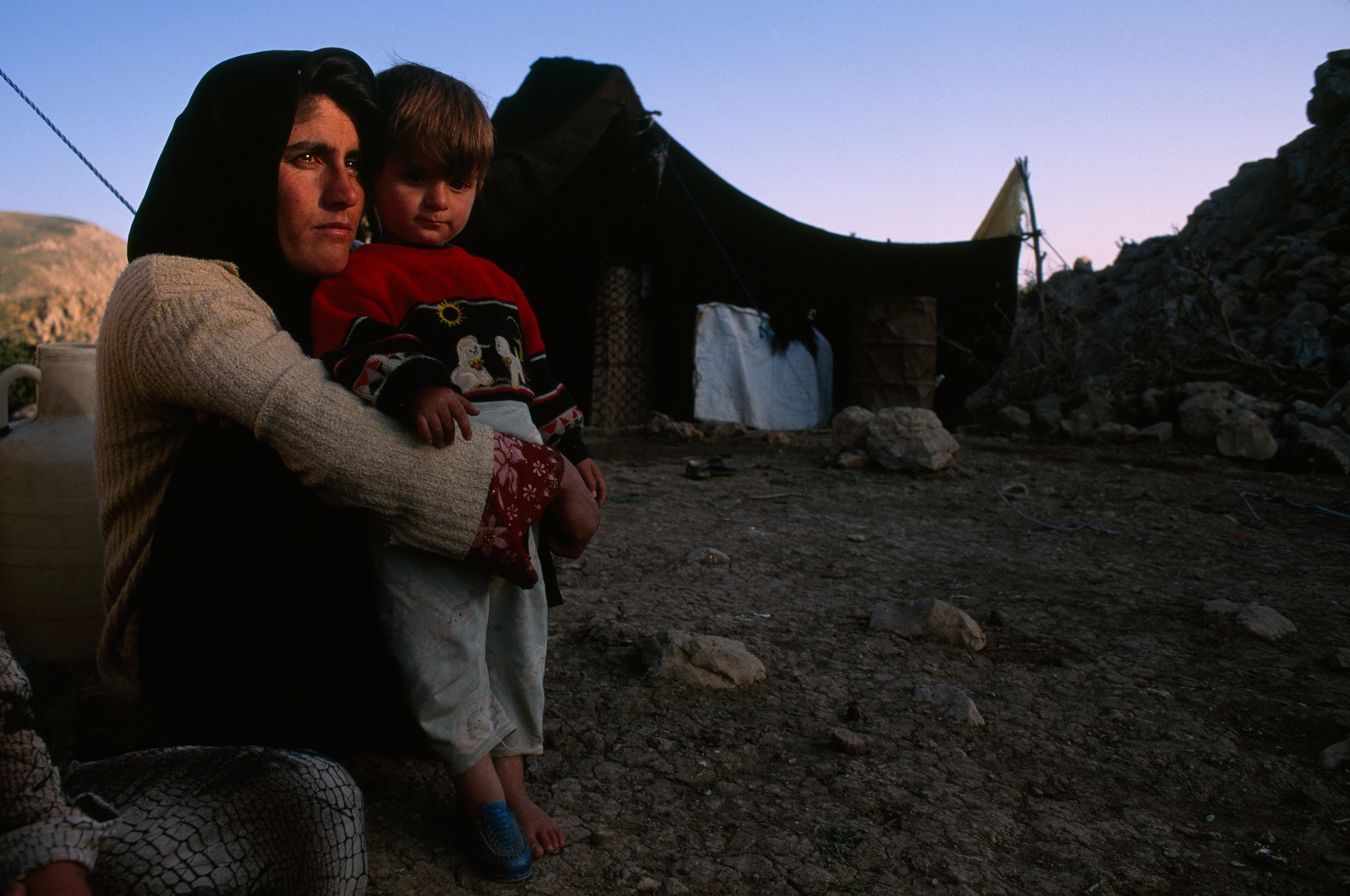 a Lur mother and son near their black goat-hair tent