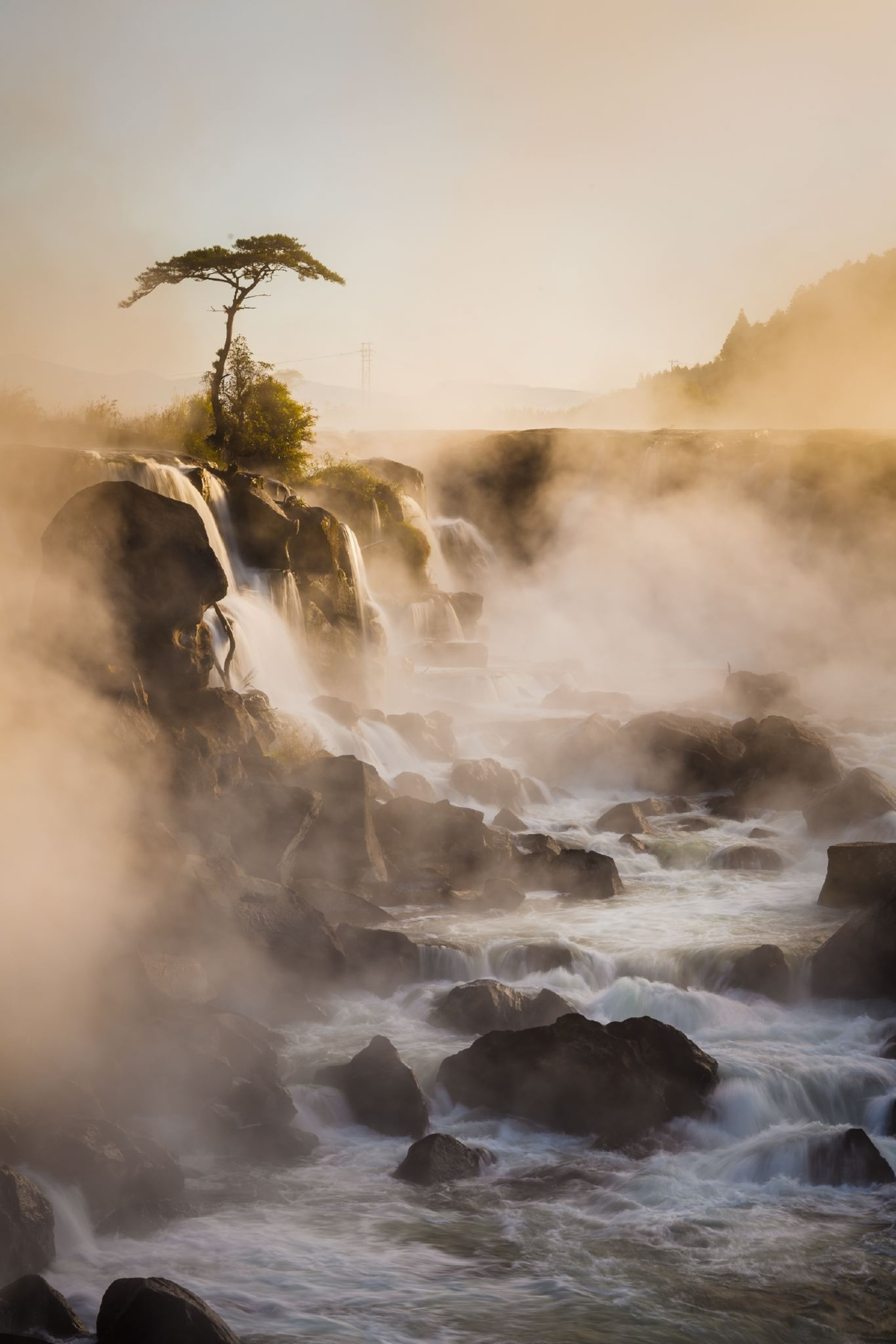 steam rising from Sogi No Taki waterfall at dawn in Kagoshima, Japan