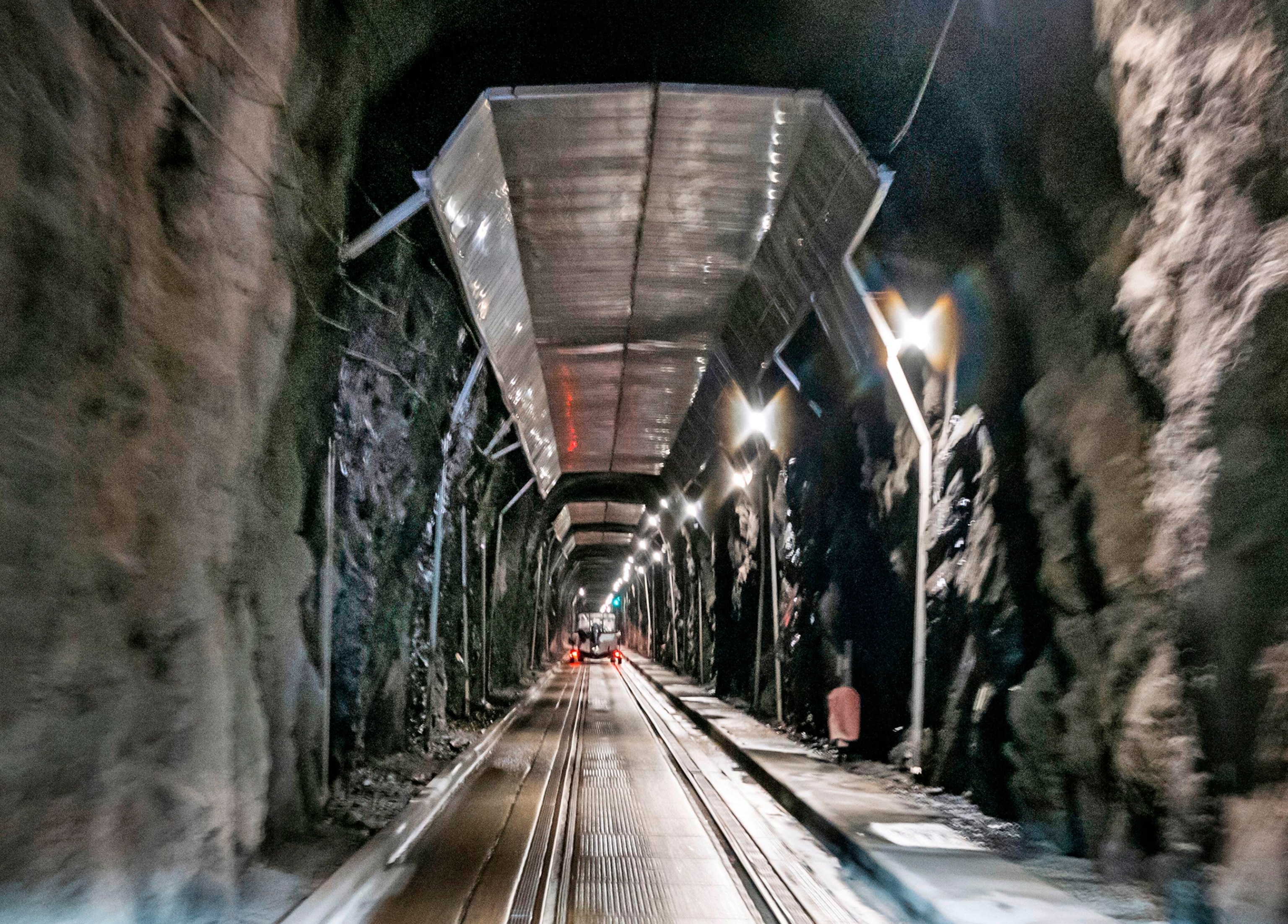 A long underground tunnel extends into the distance